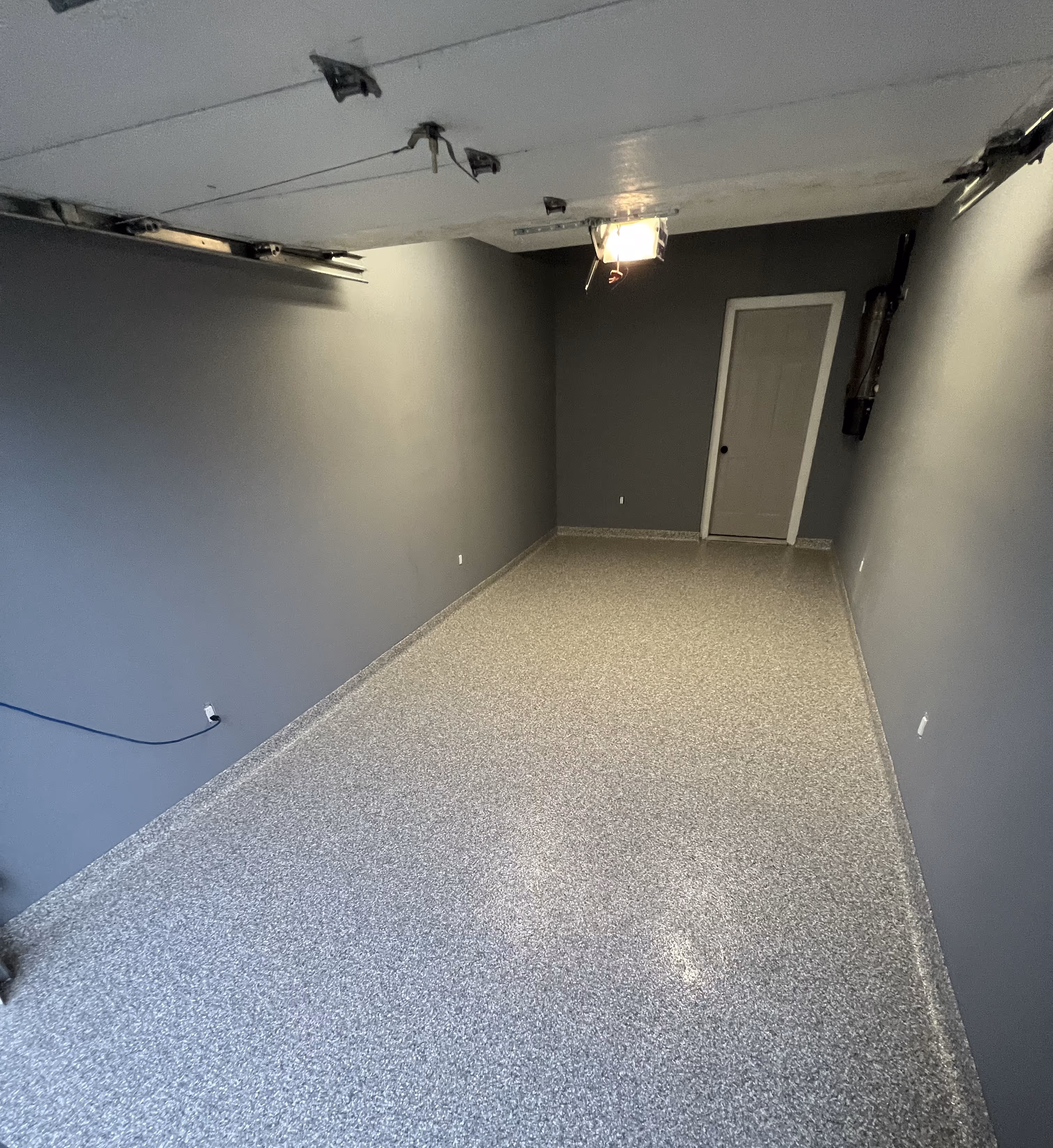 Single car garage in Tampa with an epoxy flake floor