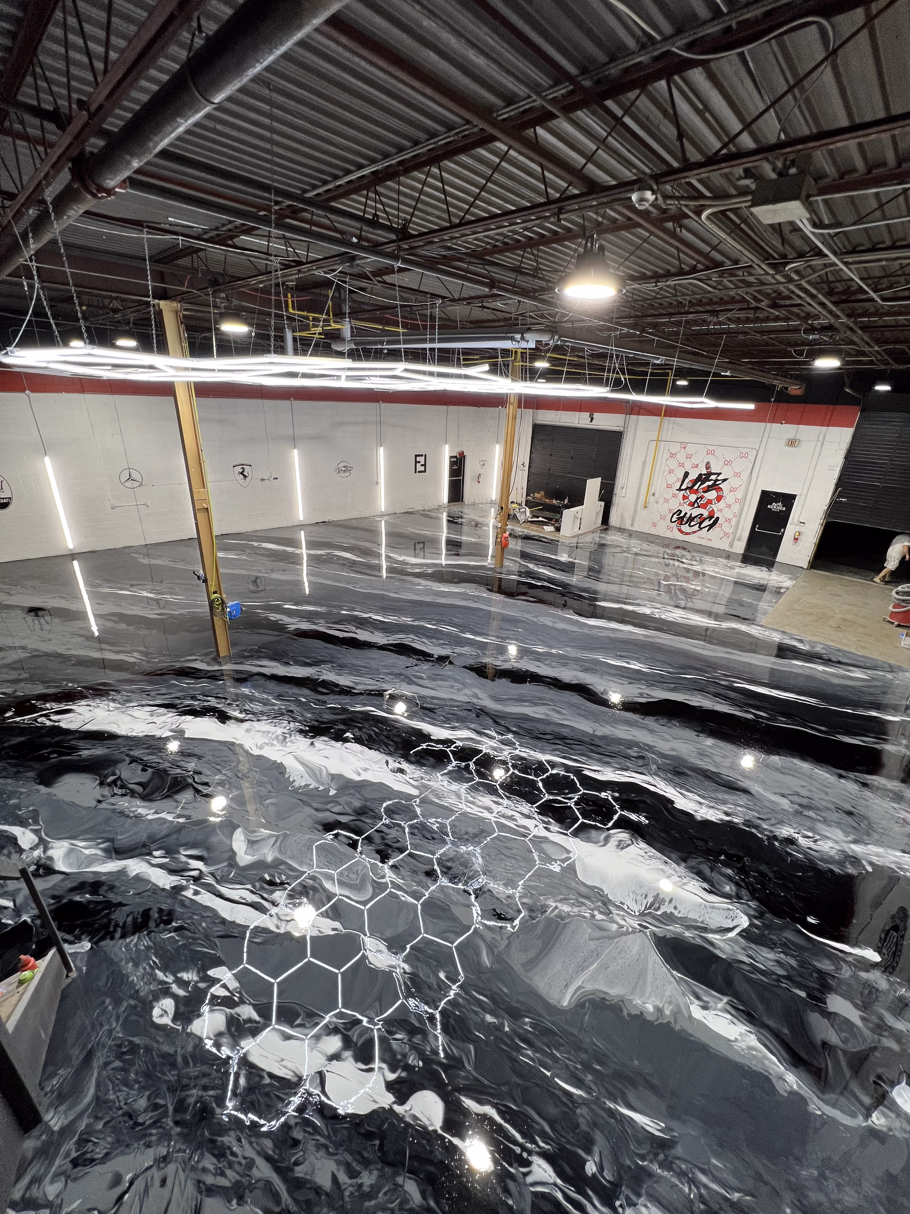 Grey and white metallic epoxy floor coating in a commercial building