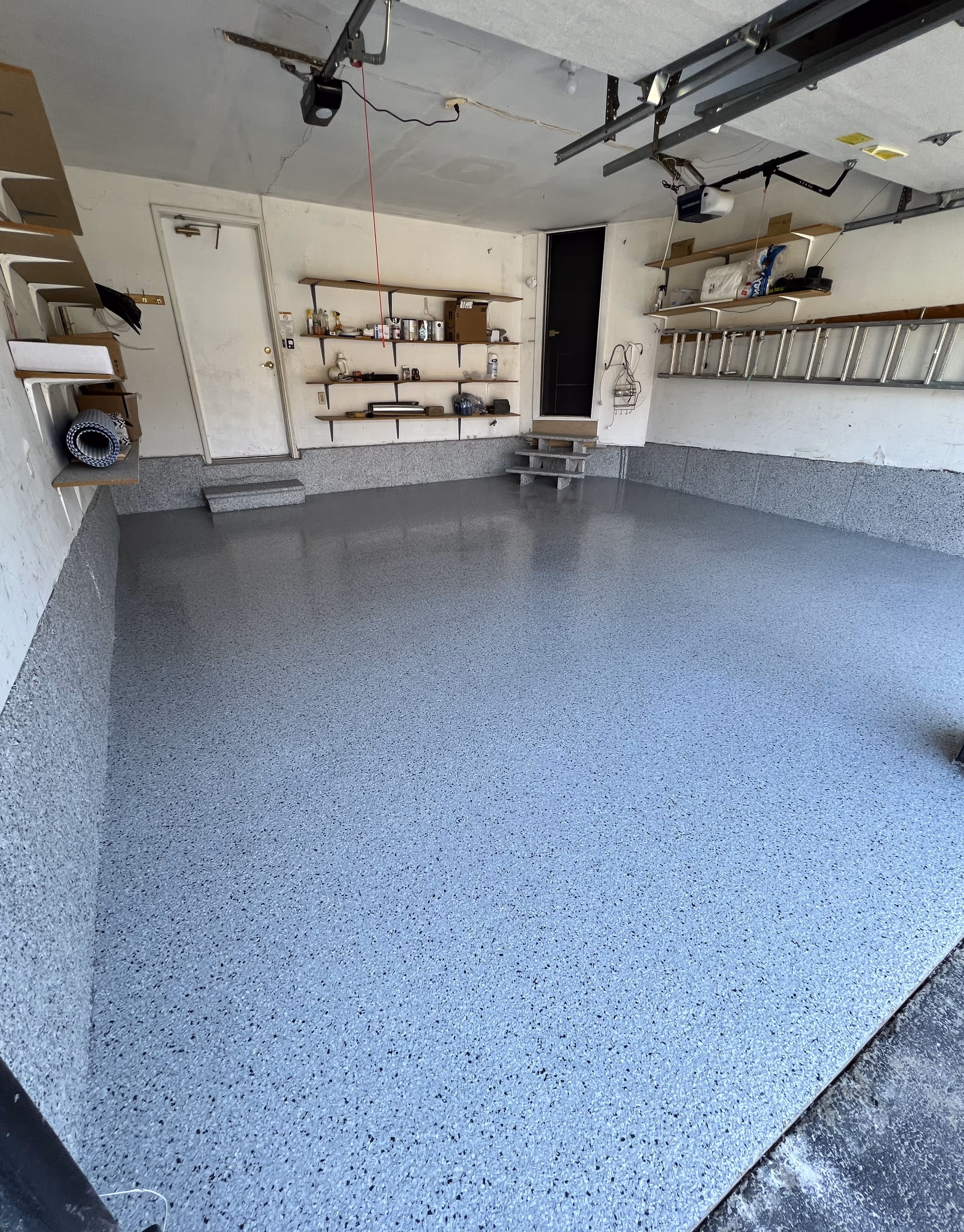 Grey epoxy floor inside a Tampa garage