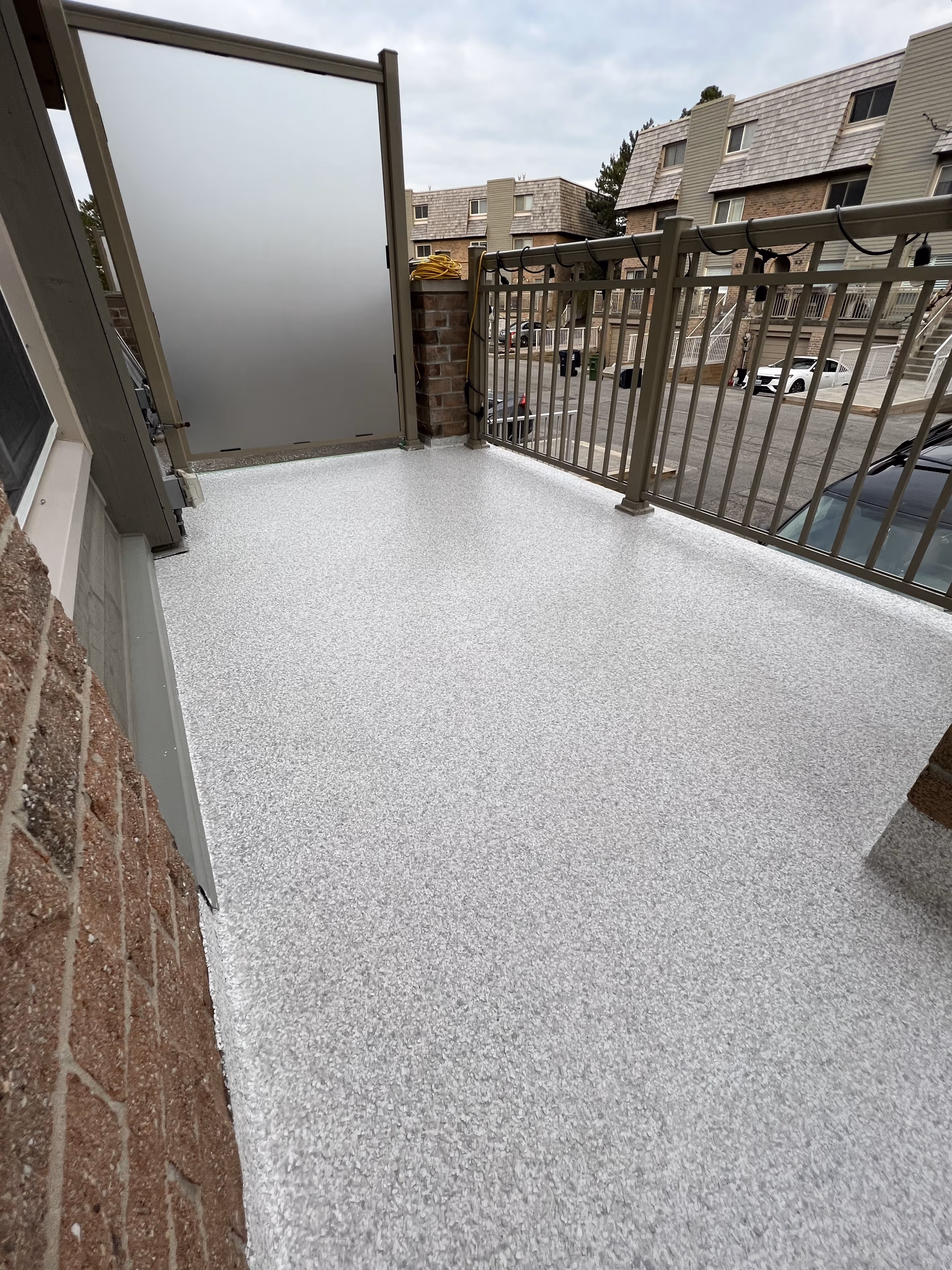 Porch with a fresh polyaspartic concrete coating in Tampa