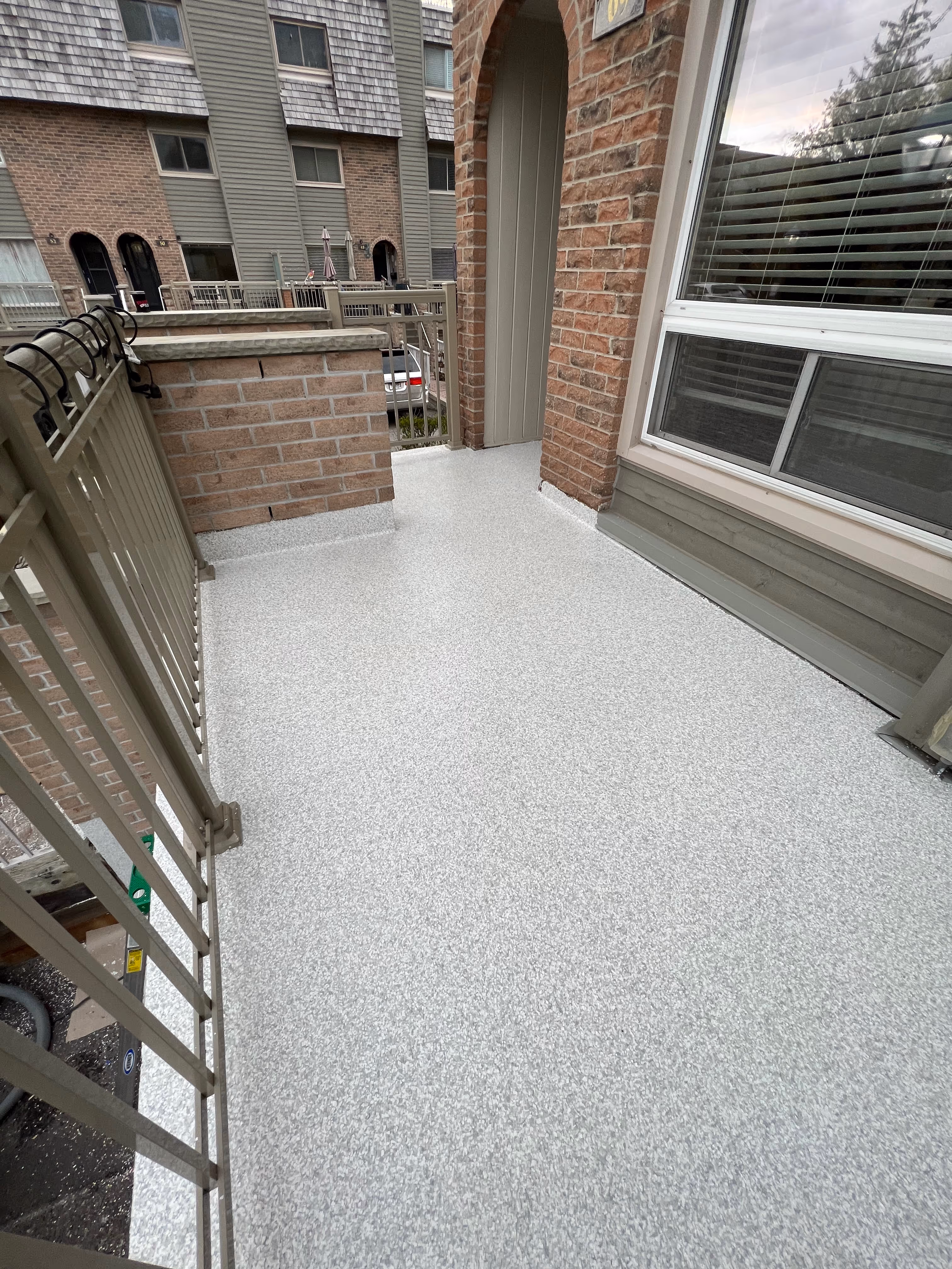 UV resistant polyaspartic concrete coating on a porch