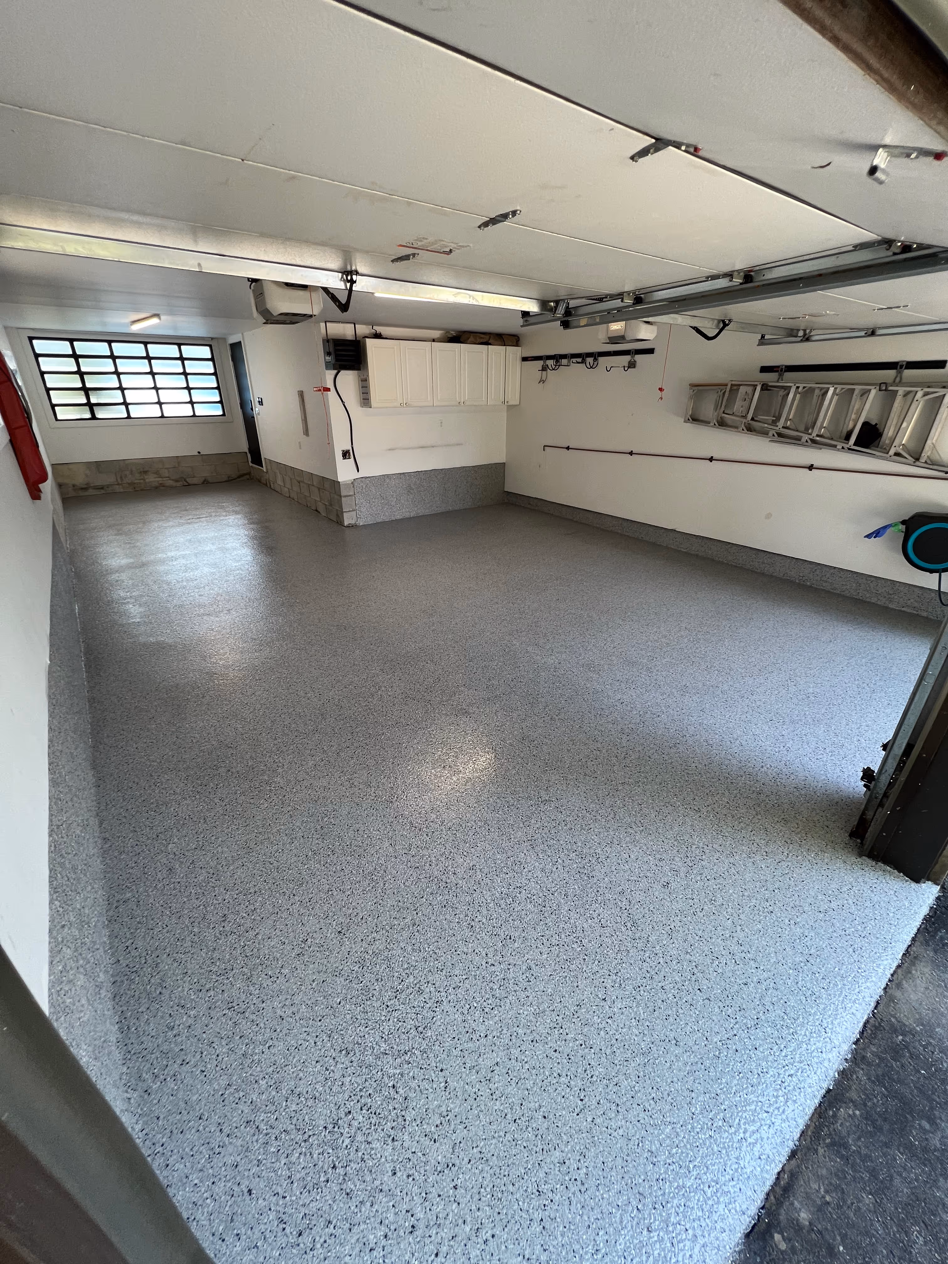 Double car garage with a new epoxy floor in Tampa FL