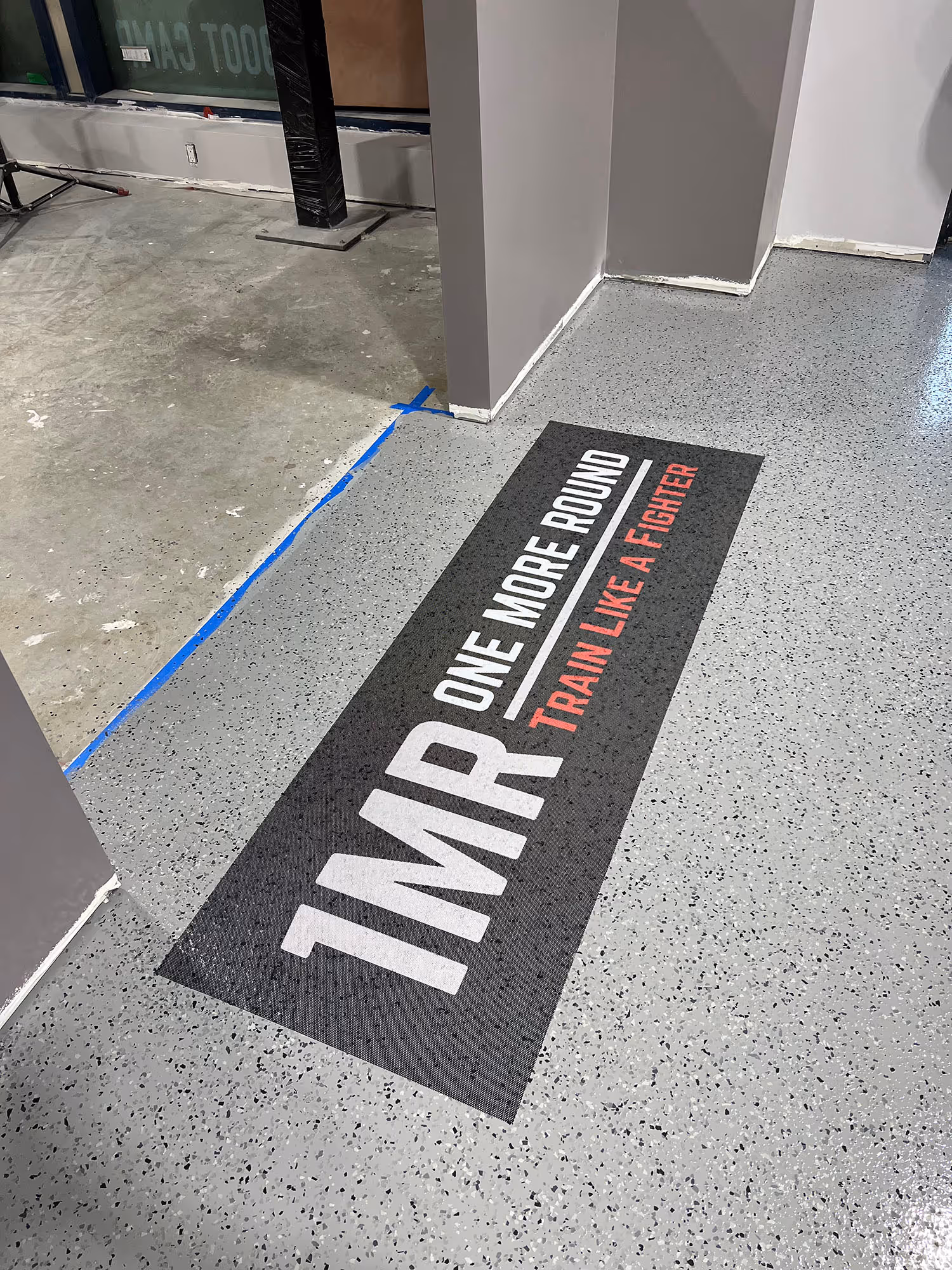 Commercial building entrance with logo in epoxy floor