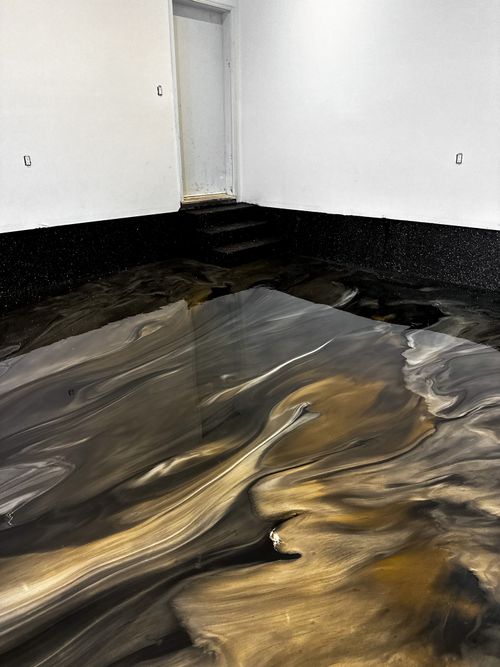 Brown and gold metallic epoxy floor coating in Tampa Florida