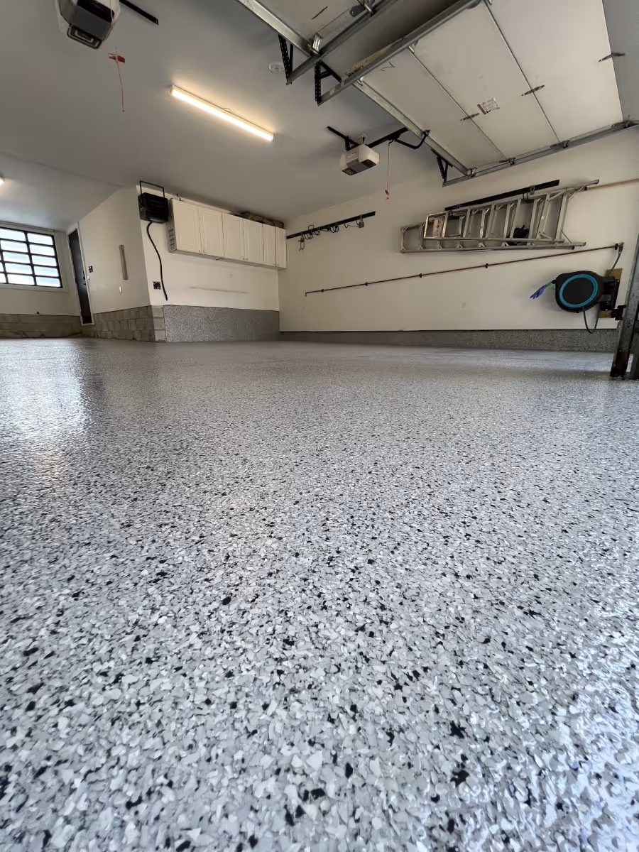 Epoxy flake flooring inside a double garage