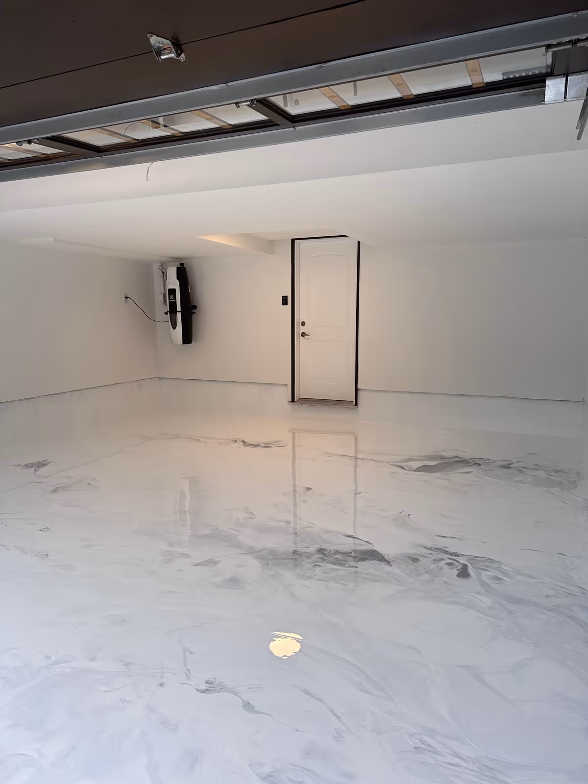 White metallic epoxy floor coating inside a Tampa Florida garage