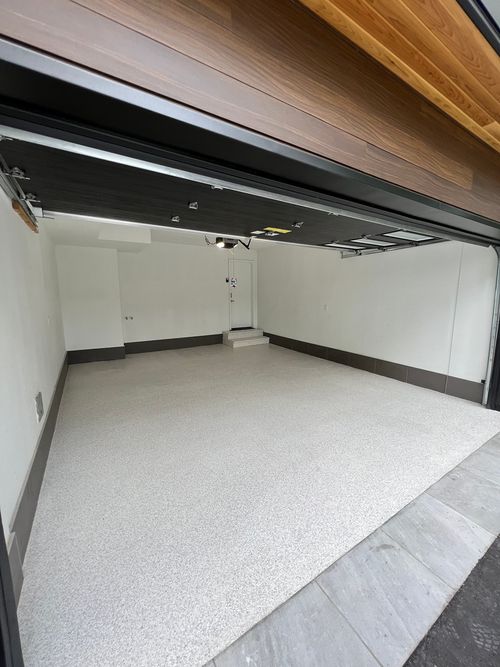 Brand new garage with a white epoxy flake floor