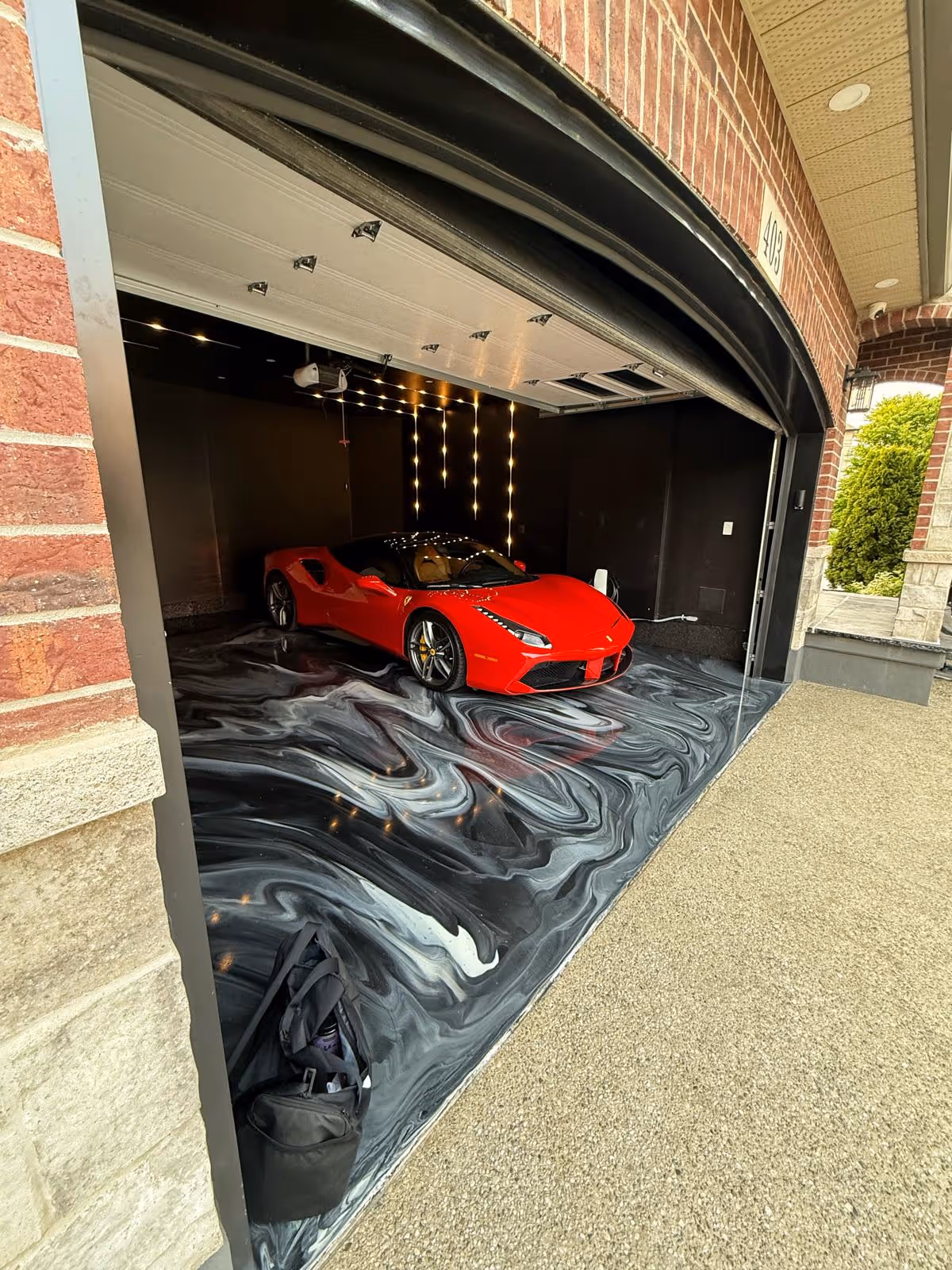 Ferrari on Metallic Epoxy Garage Flooring