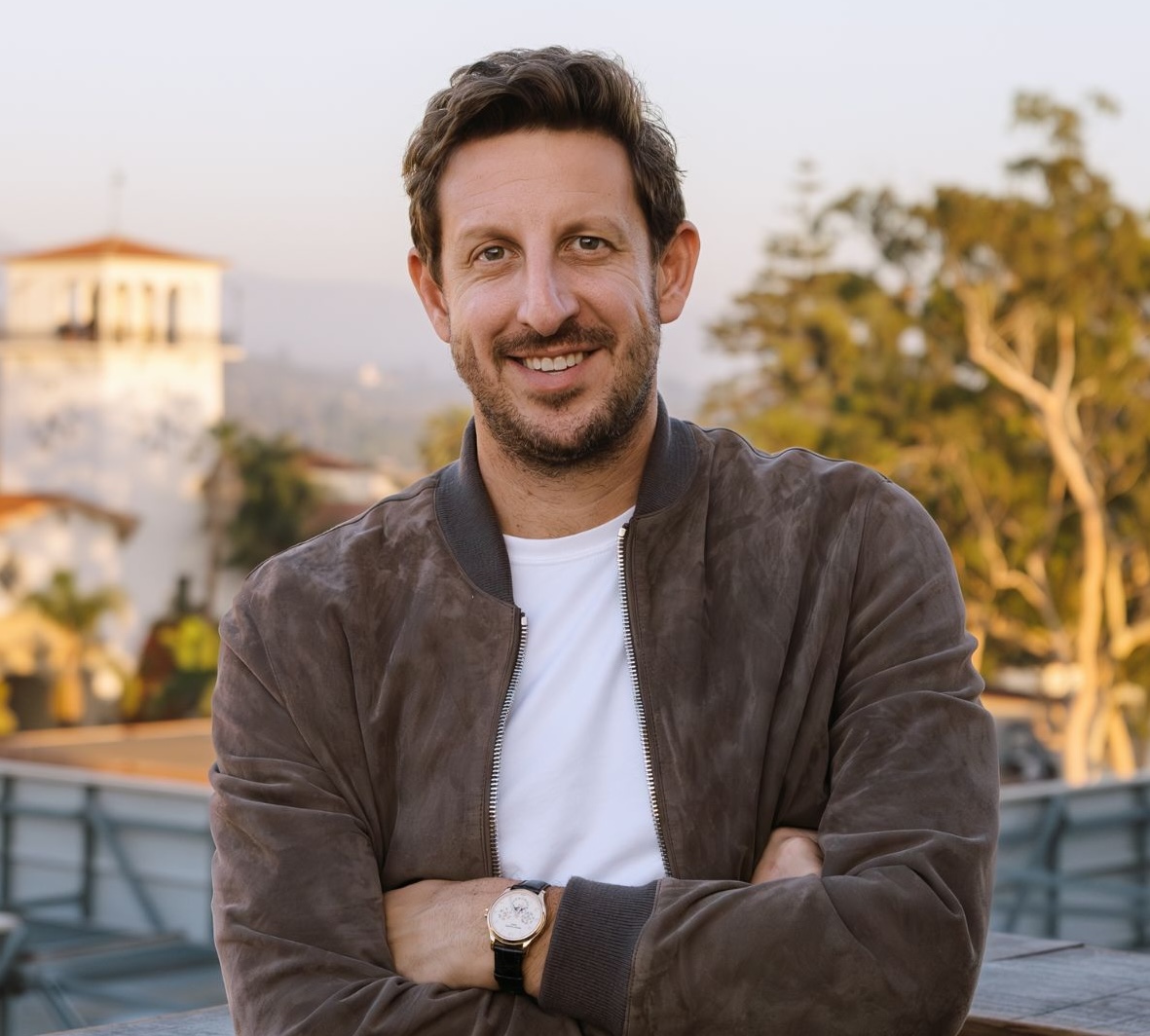 Zack Kass male with arms crossed as headshot
