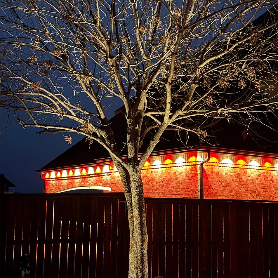 A house at night with outdoor lighting