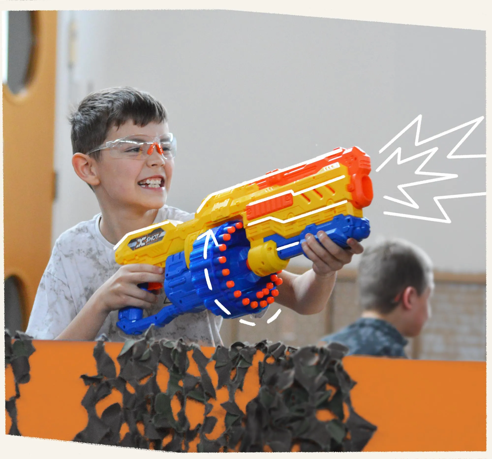 Boy shooting Nerf Ops gun