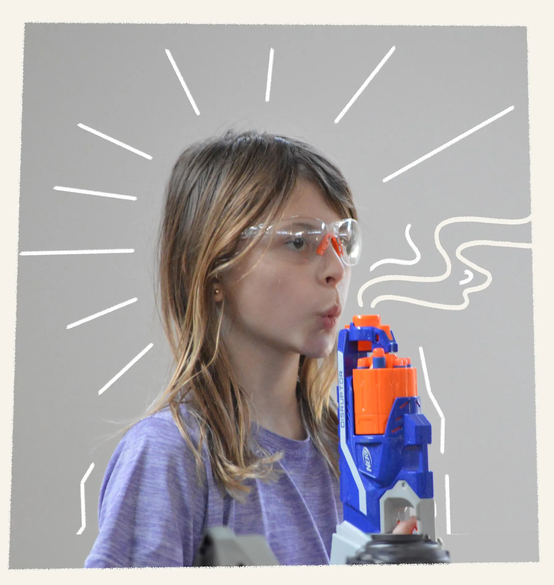 Girl with nerf ops toy gun