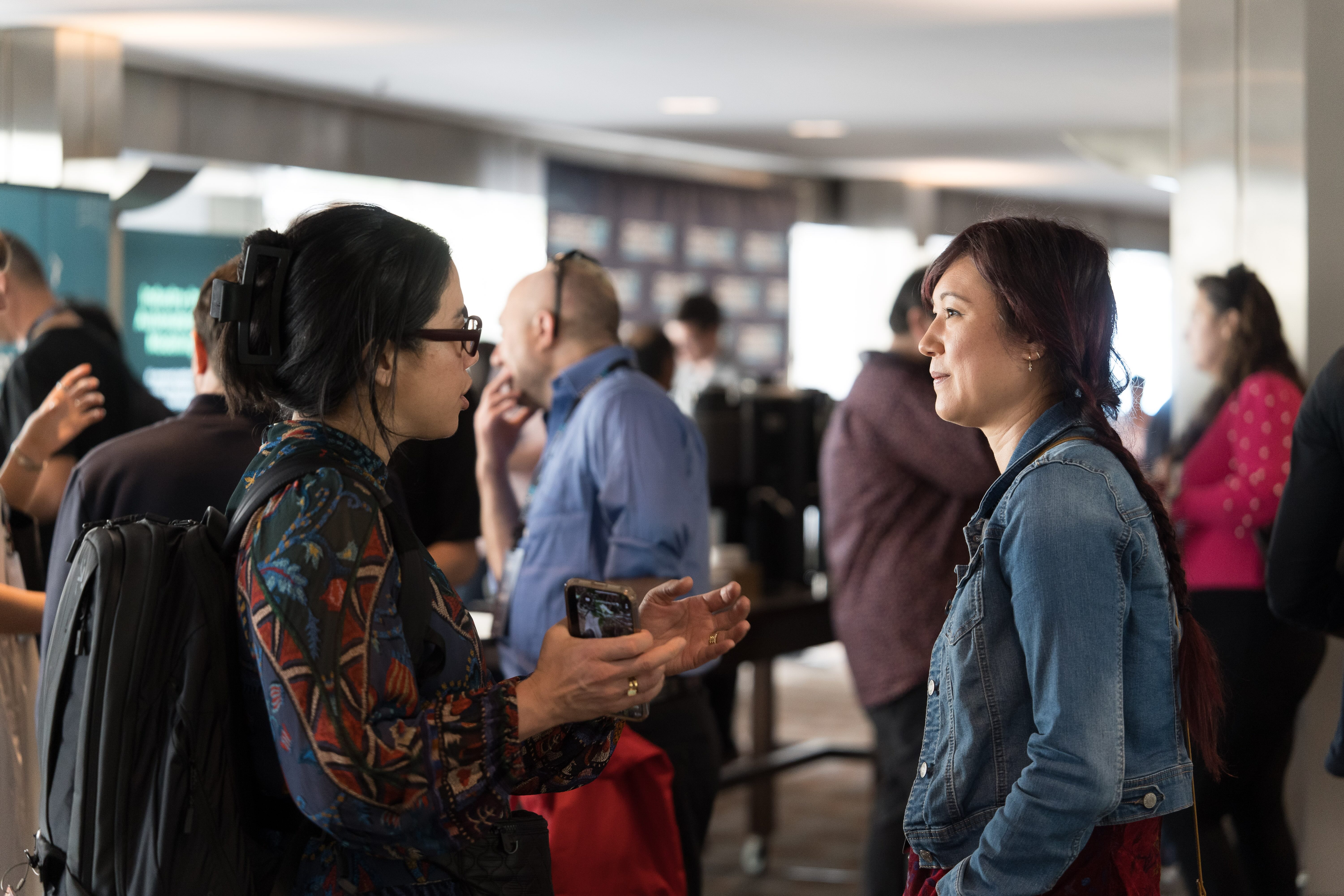 ThreatModCon attendees in conversation