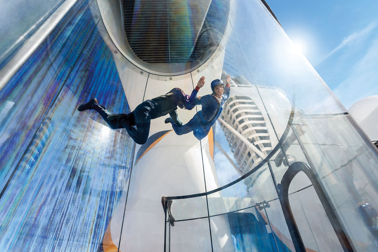 Guests using the RipCord by iFly skydiving simulator