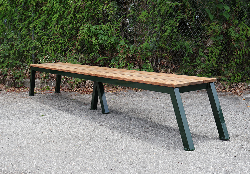 custom 9-foot ipe wood golf course bench at Quaker Ridge Golf Club, powder-coated aluminum frame