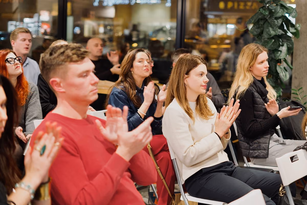 Audience applauding at Impact Night with Scott Moran, Andrew Gray and Giorgio Pontillo