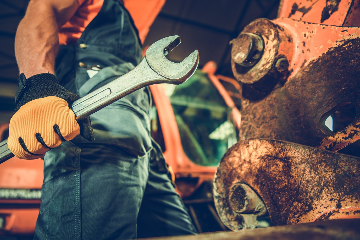 Image of employee with wrench