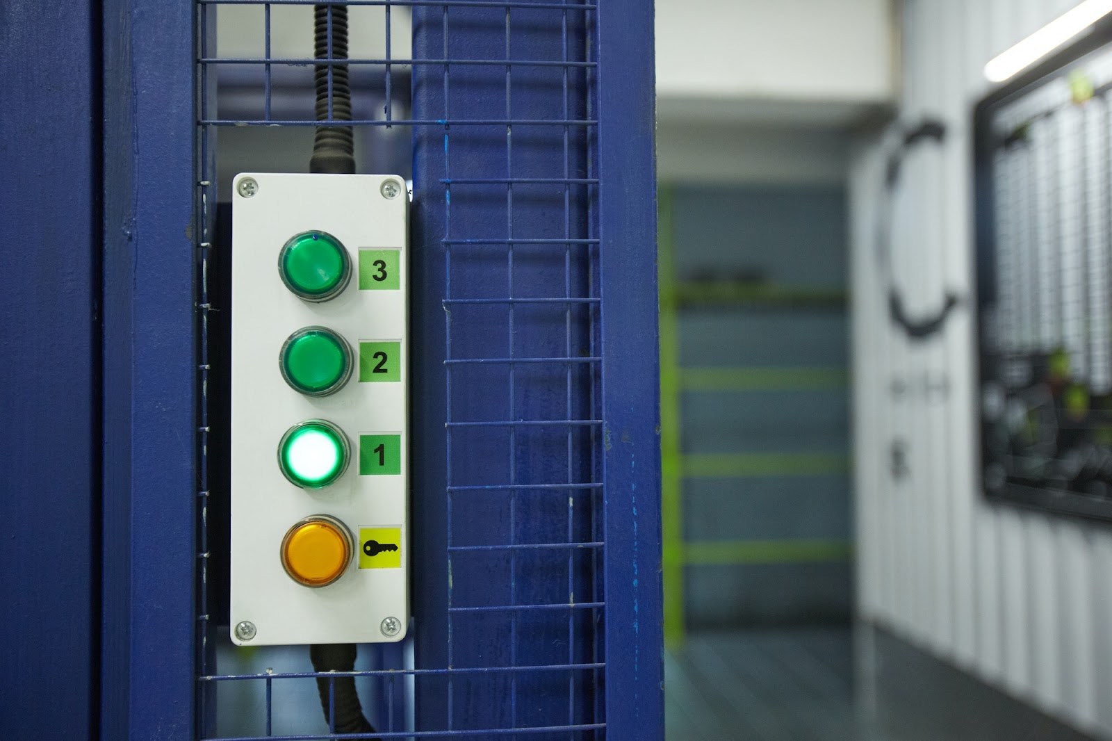 Buttons on a lift in a manufacturing facility.