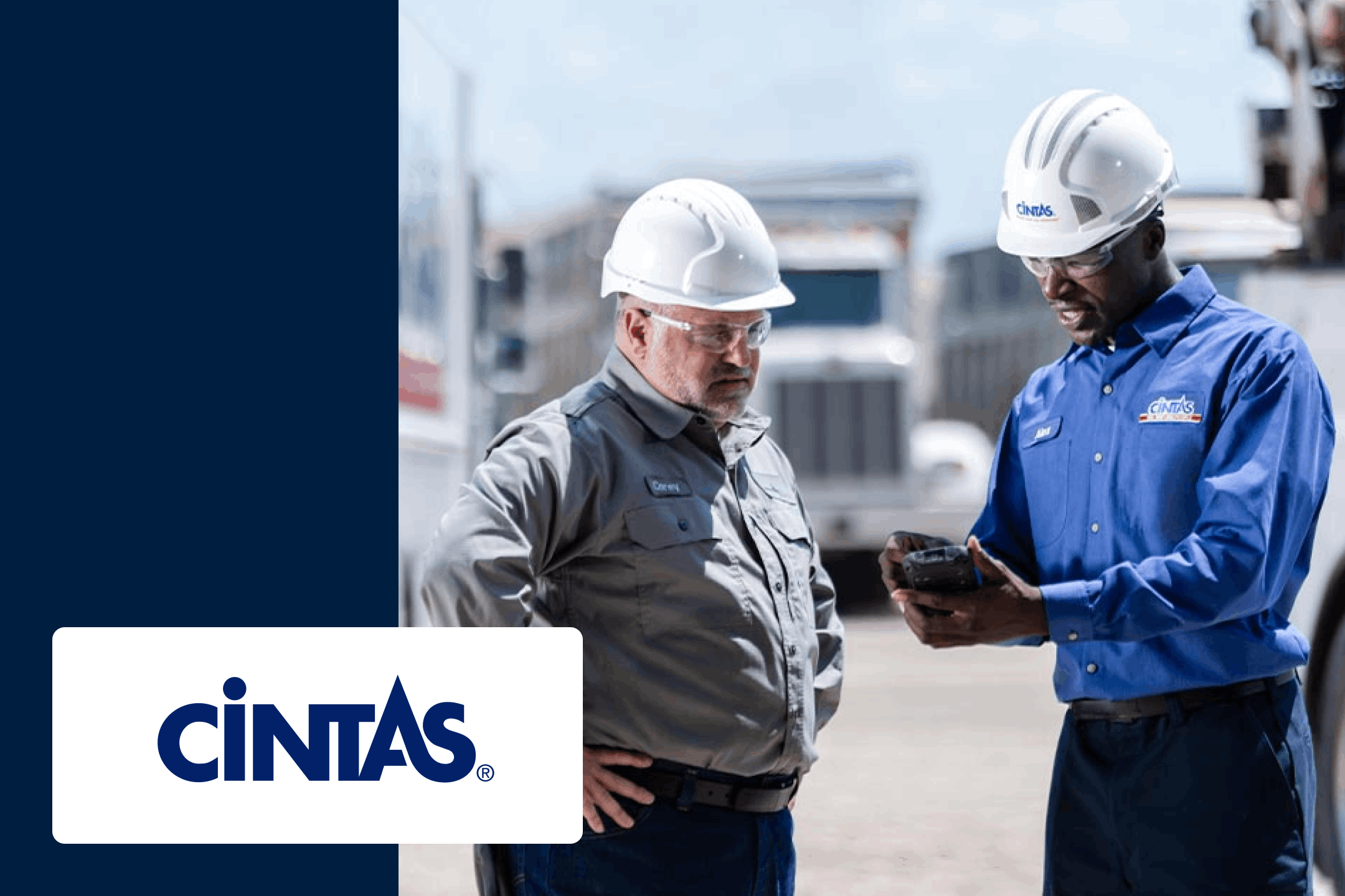 Cintas employees talking in hardhats outside of truck