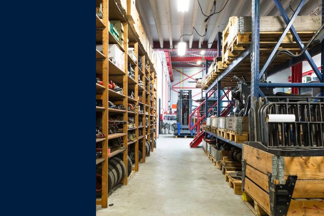 photo of a parts storage closet with tall shelves on both sides