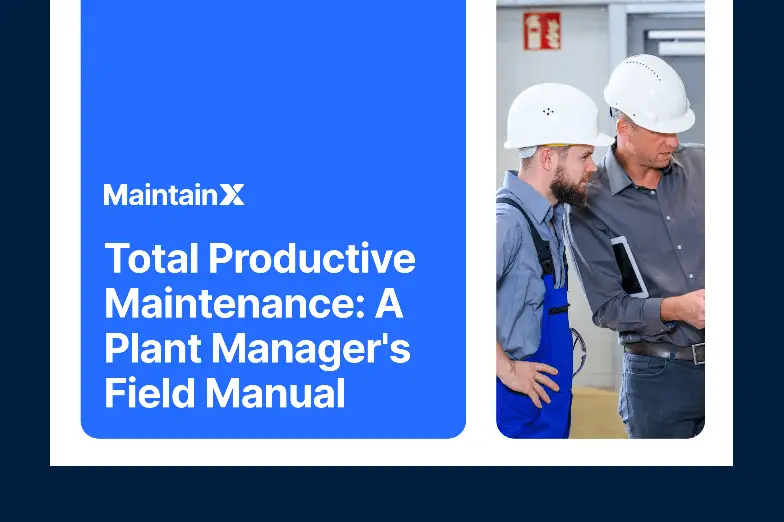 Two technicians inspecting industrial equipment.