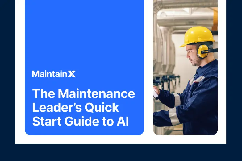 Industrial worker using a tablet beside processing equipment.