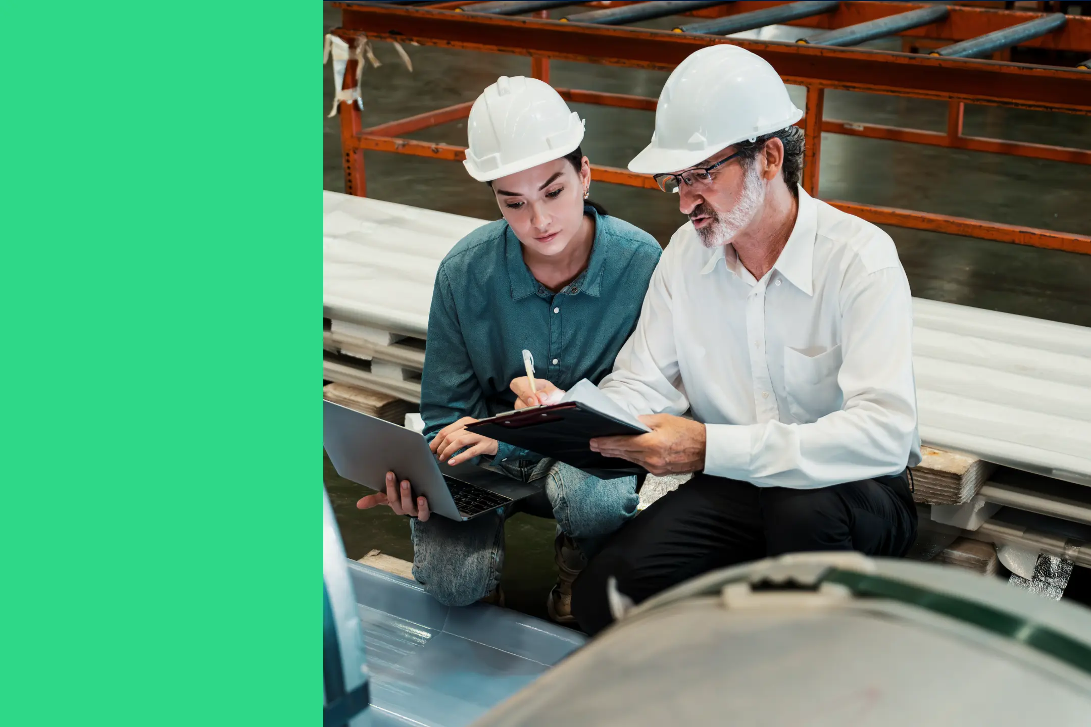 Two maintenance technicians consult a mobile device on a manufacturing plant floor to decide how to improve OEE.