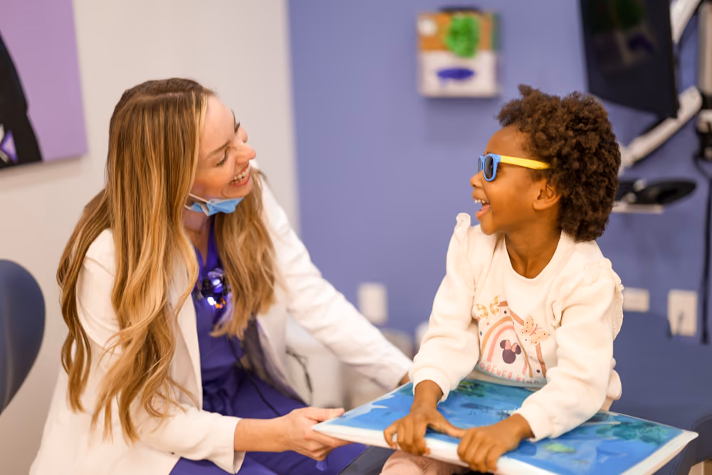 Kid is playing with Dr. Breanna Barnes
