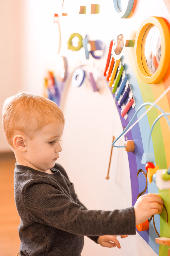 Kid is playing in Song Bird Pediatric Dentist Clinic