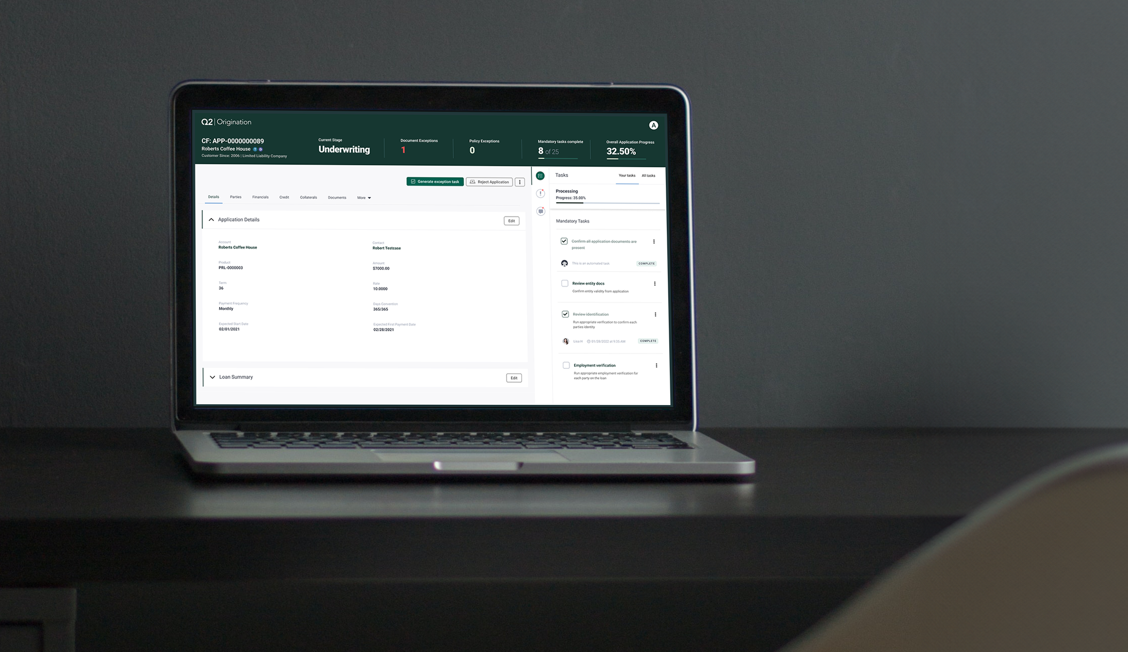 laptop with Q2 Cloud Lending on a desk