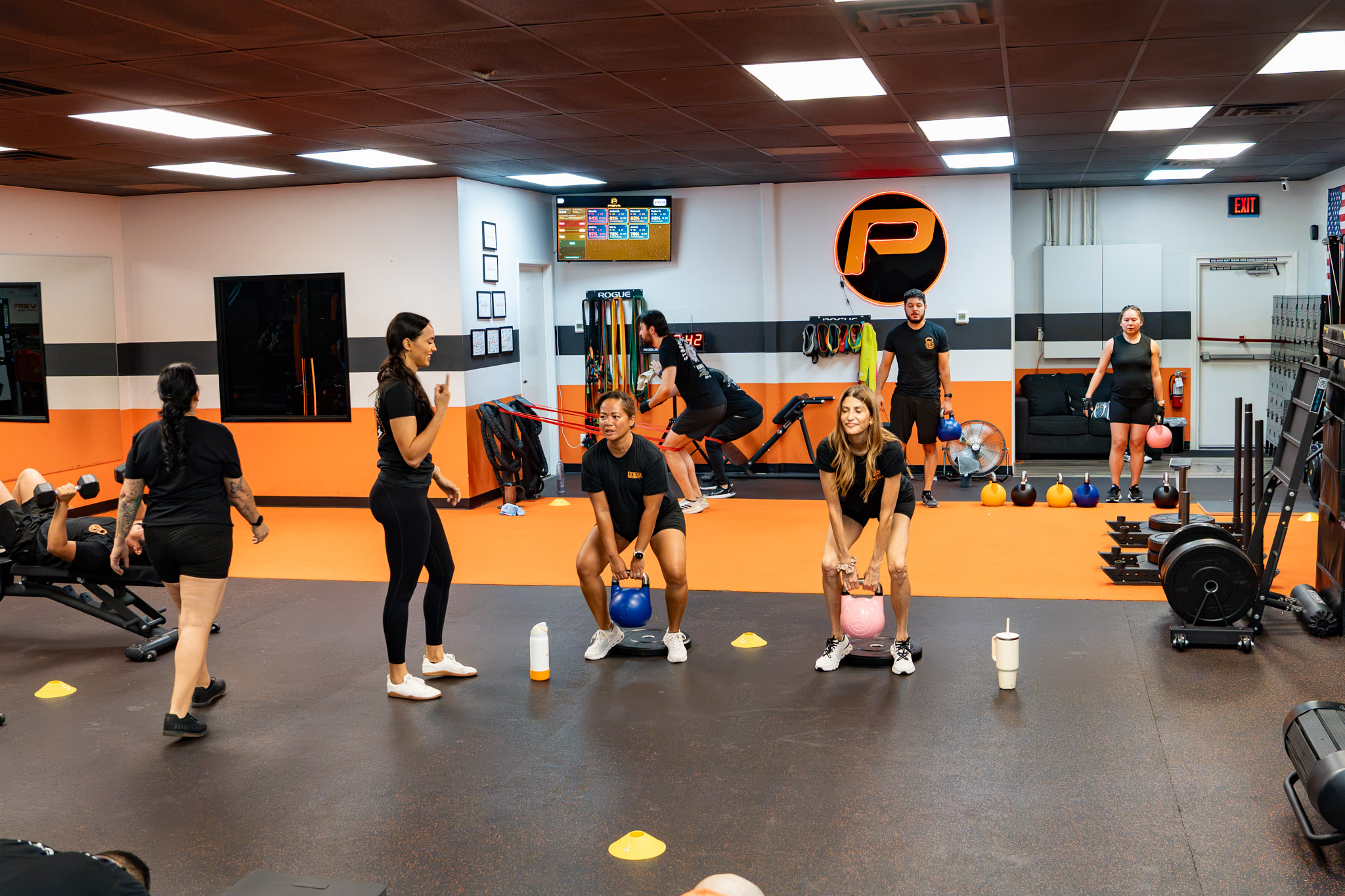 Small group kettlebell class led by coaches at PRSVR Gym in Las Vegas