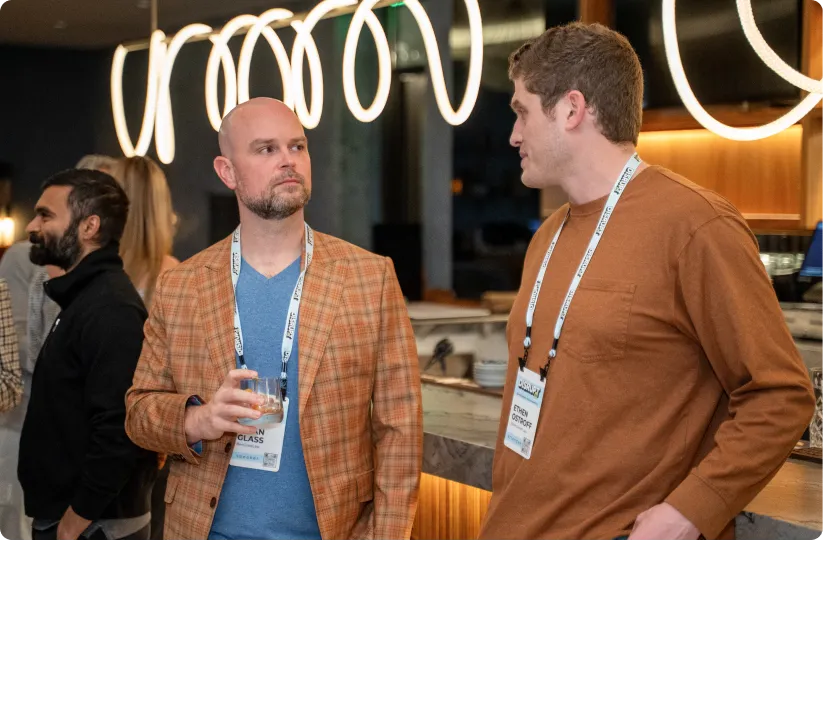 two people speaking at the conference