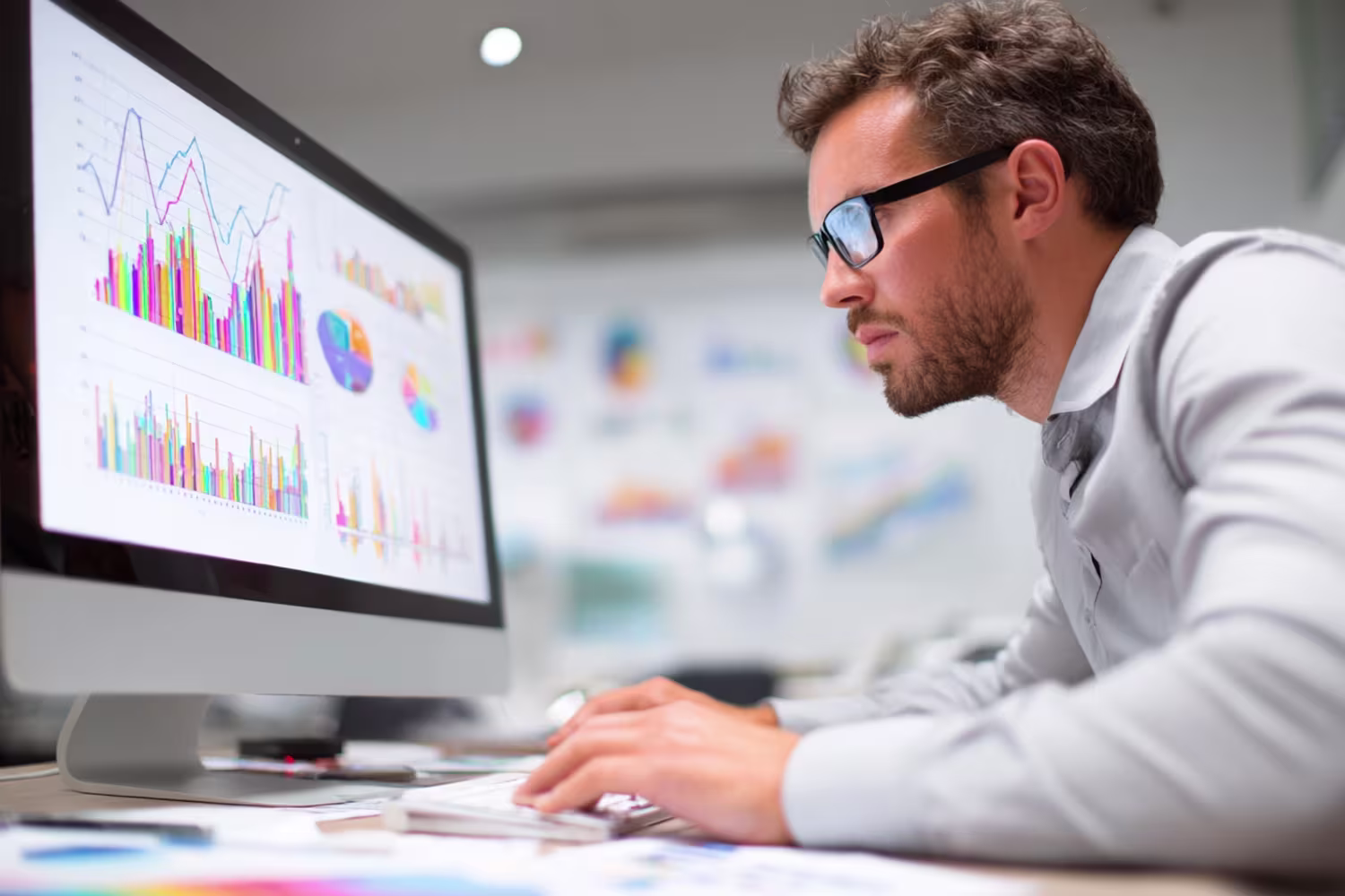 IT professional analyzing financial charts