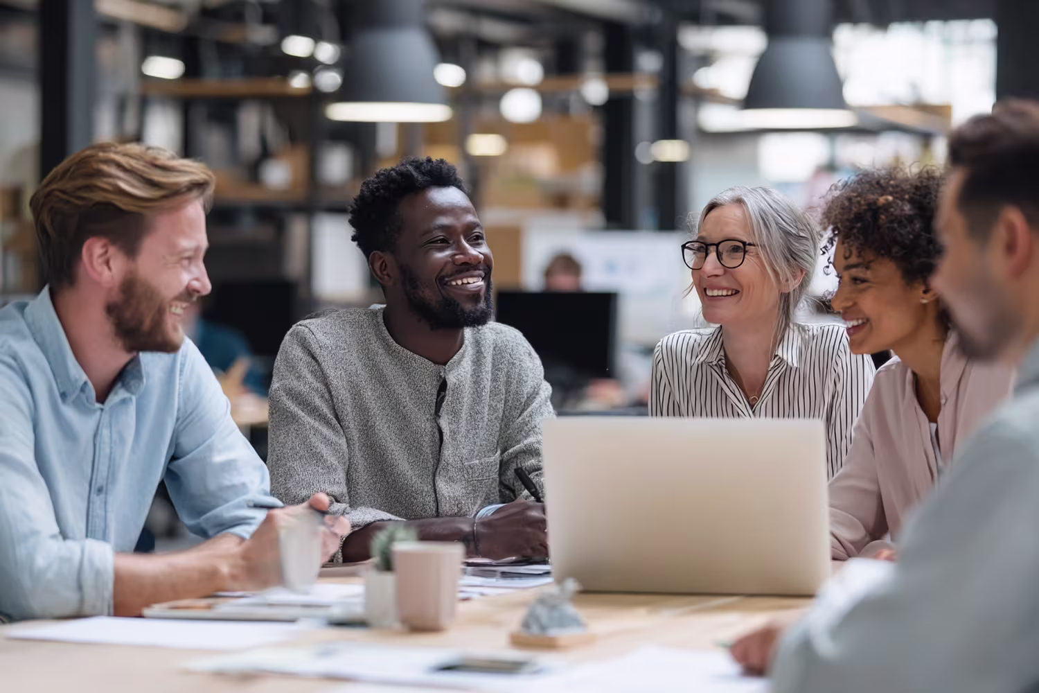 Diverse team discussing IT in finance industry
