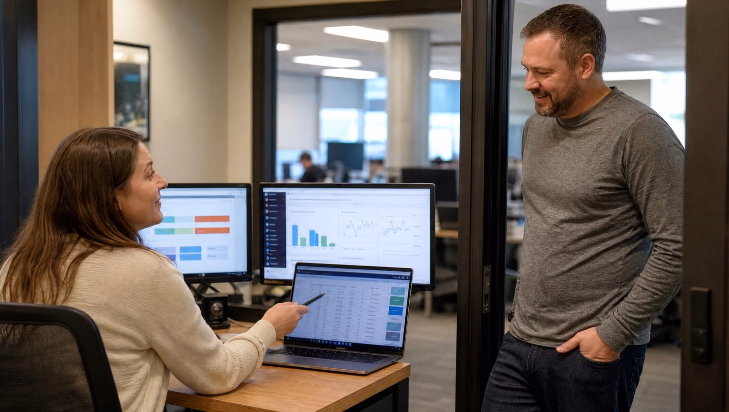 Man reviews cloud backup report by office plants 60