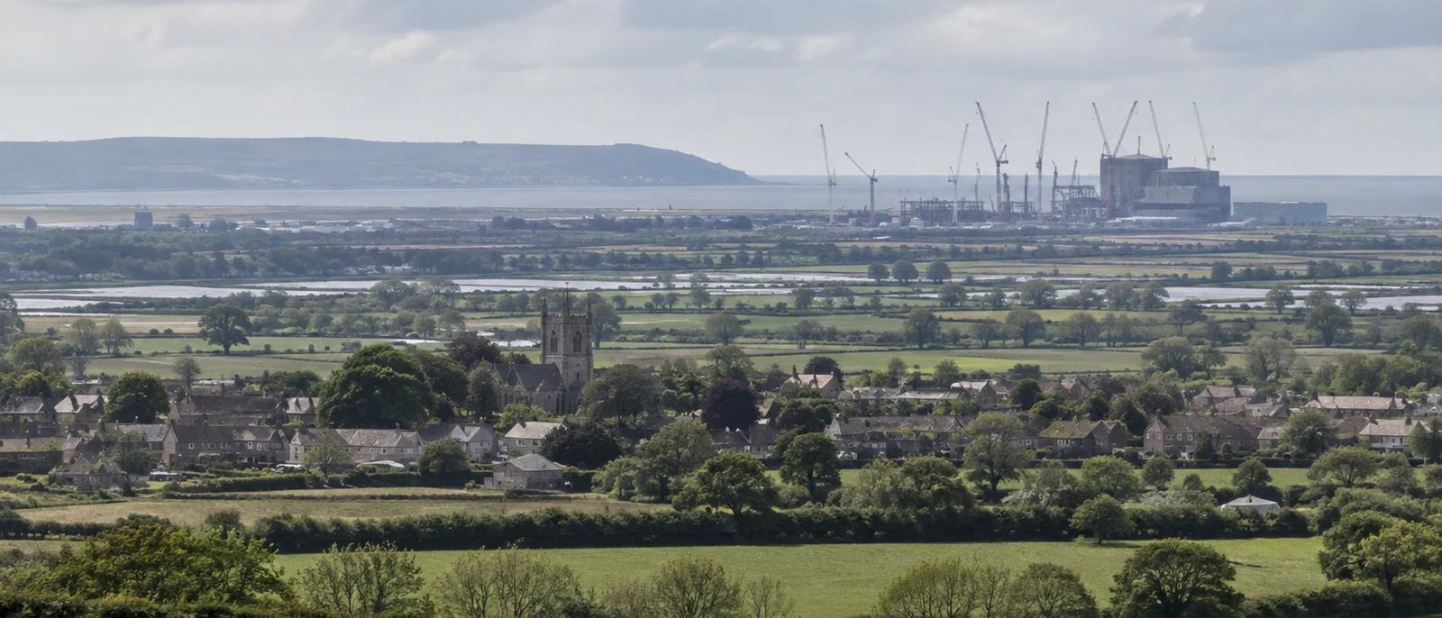 Bridgwater, Somerset. EDF confirmed a GBP 35 billion cost for Hinkley Point C in February 2026, with Unit 1 powering up in 2030.