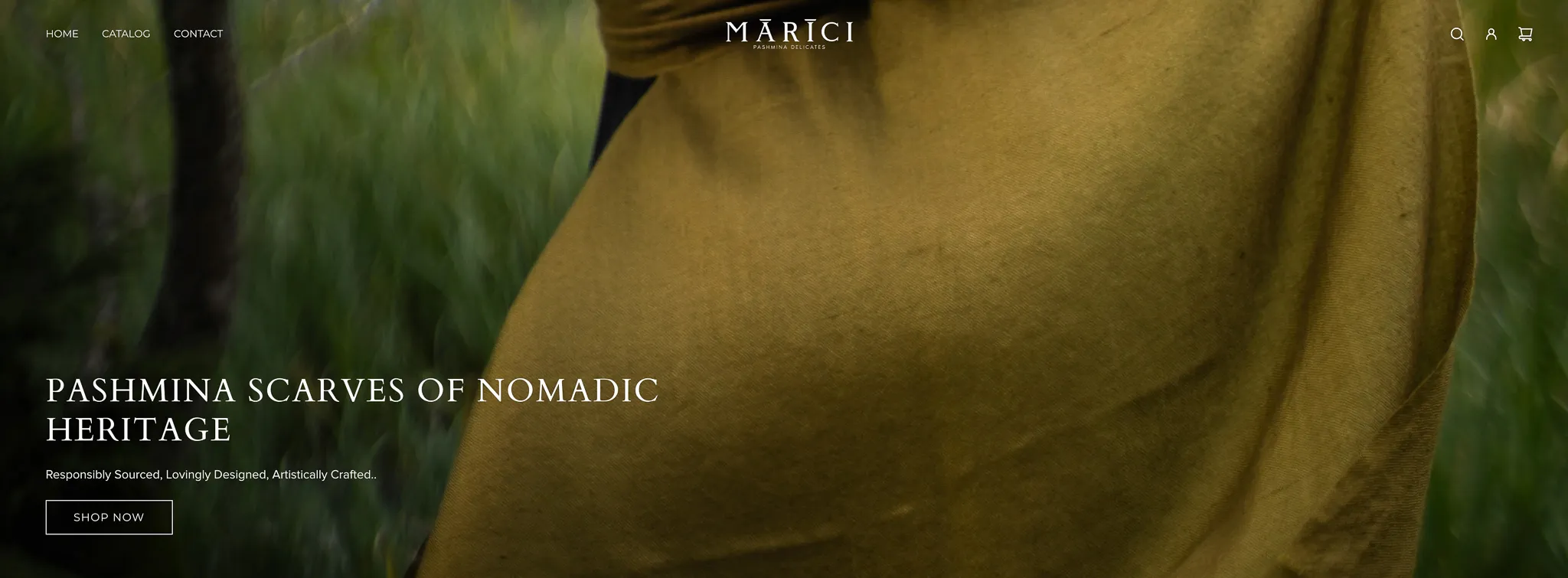 Close-up of a brown pashmina scarf draped over a person 