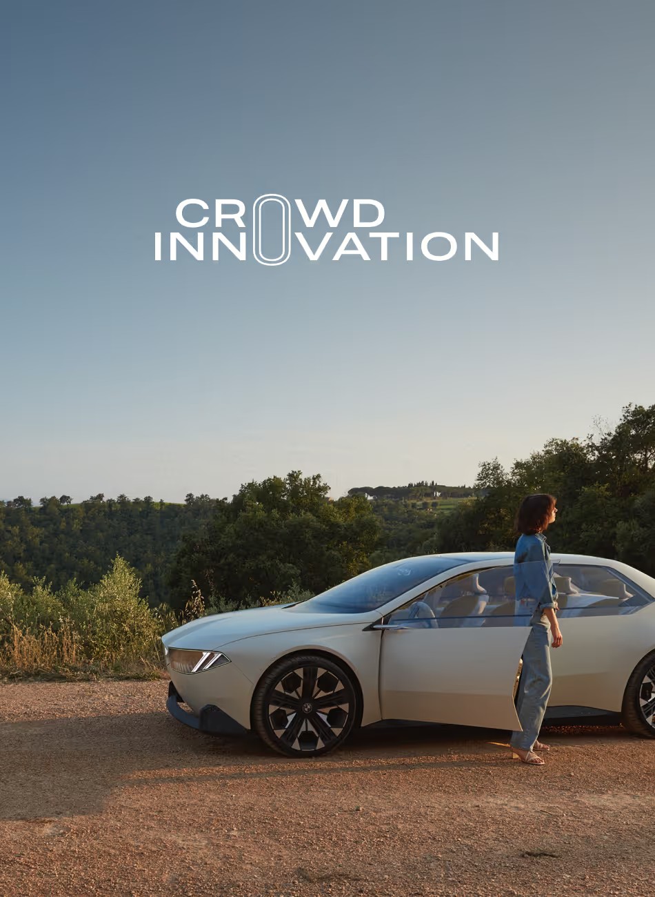 BMW Crowd Innovation key visual, an electric BMW parked on a hill at sunset