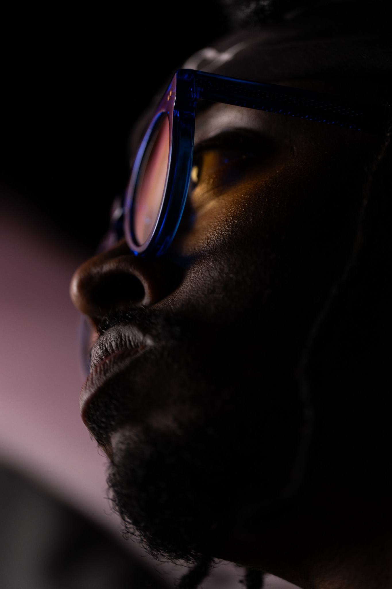 Tim by FADETOBLACK, studio portrait photography, image 24: Low-key studio portraits of a man against a black background, wrapped in flowing pink tulle