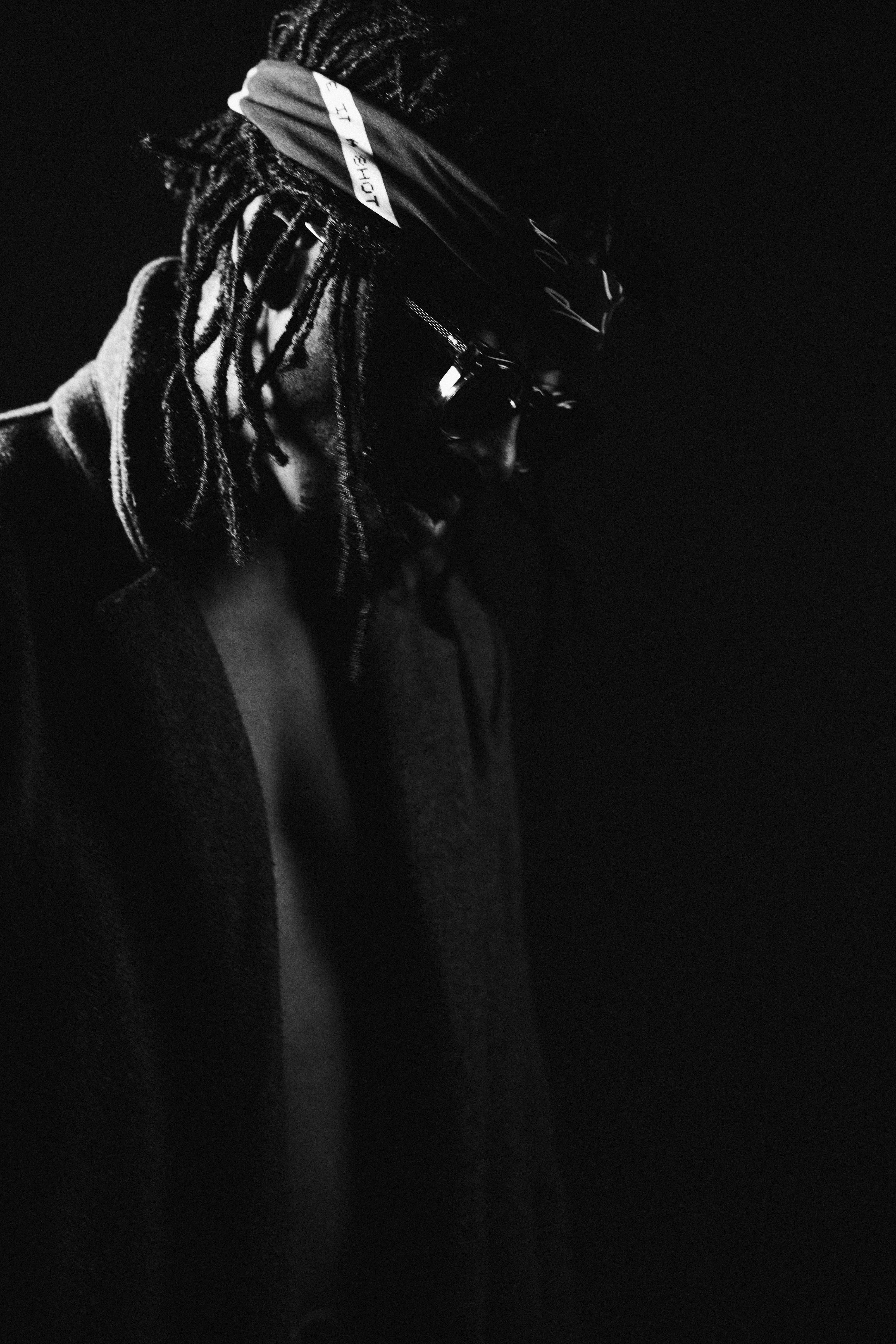 Tim by FADETOBLACK, studio portrait photography, image 6: Low-key studio portraits of a man against a black background, wrapped in flowing pink tulle