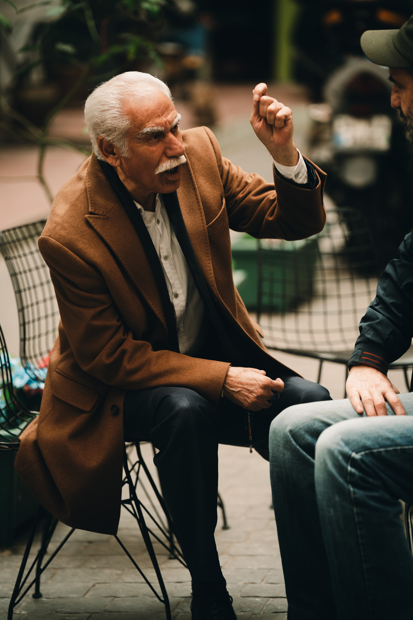 Fragments of Istanbul by FADETOBLACK, street photography, image 15: Street scenes from Istanbul: an elderly man clasping prayer beads behind his back, a cargo ship passing a