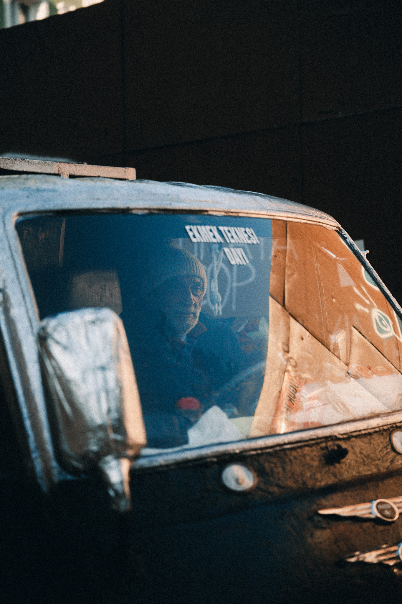 Fragments of Istanbul by FADETOBLACK, street photography, image 7: Street scenes from Istanbul: an elderly man clasping prayer beads behind his back, a cargo ship passing a