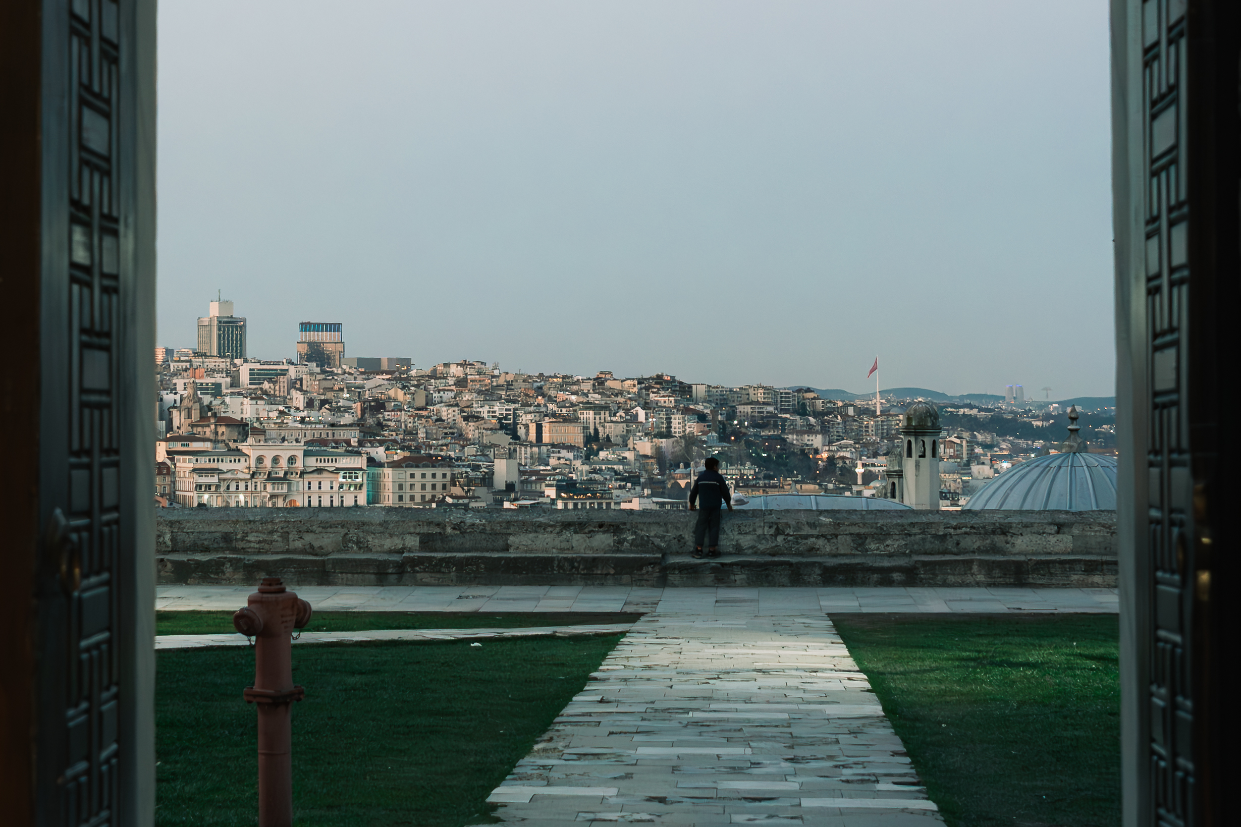 Fragments of Istanbul by FADETOBLACK, street photography, image 21: Street scenes from Istanbul: an elderly man clasping prayer beads behind his back, a cargo ship passing a