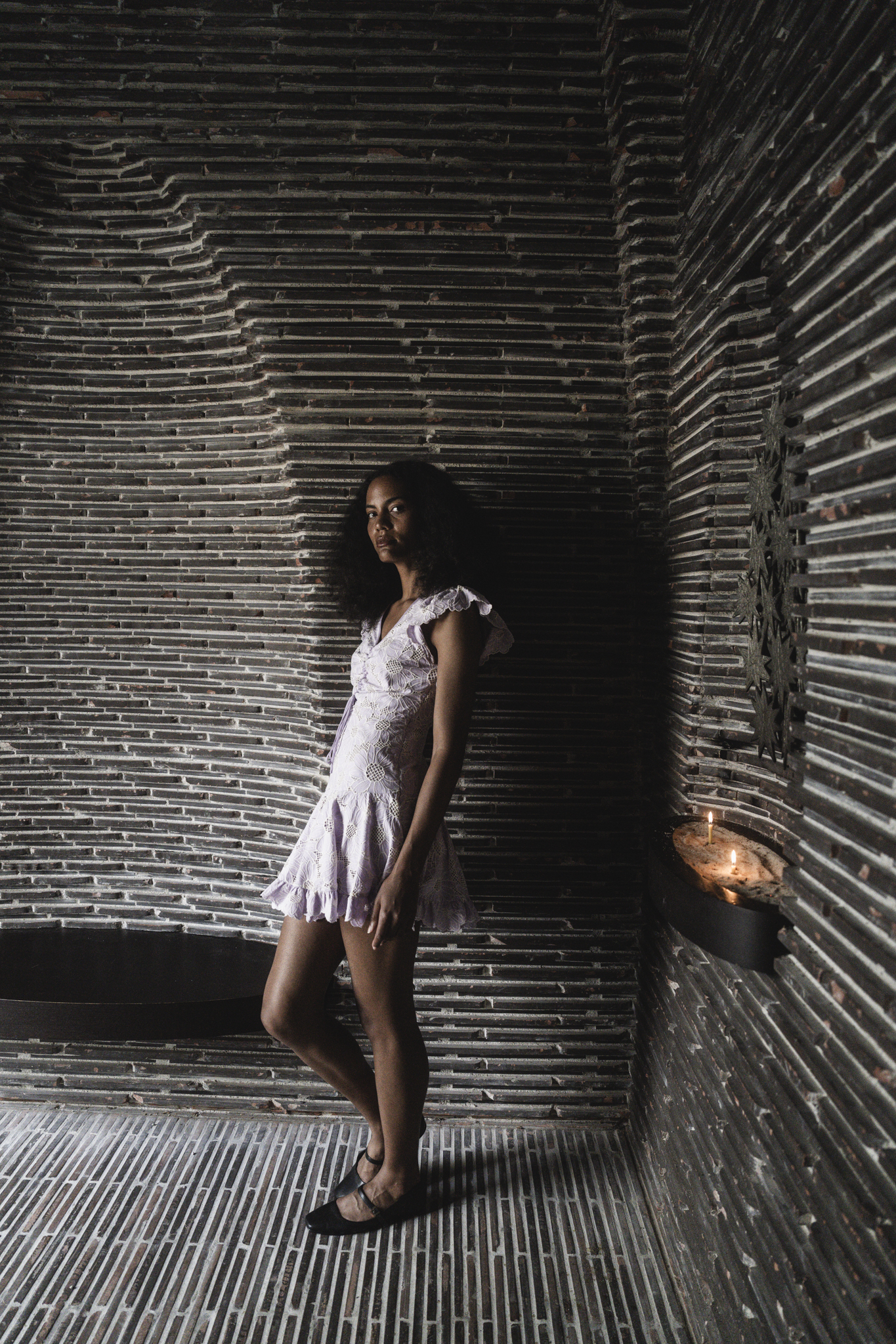 A Dance of Contradictions by FADETOBLACK, fine art portrait photography, image 6: Portraits of a woman with voluminous curly hair in a short ruffled lilac lace dress, moving between bright