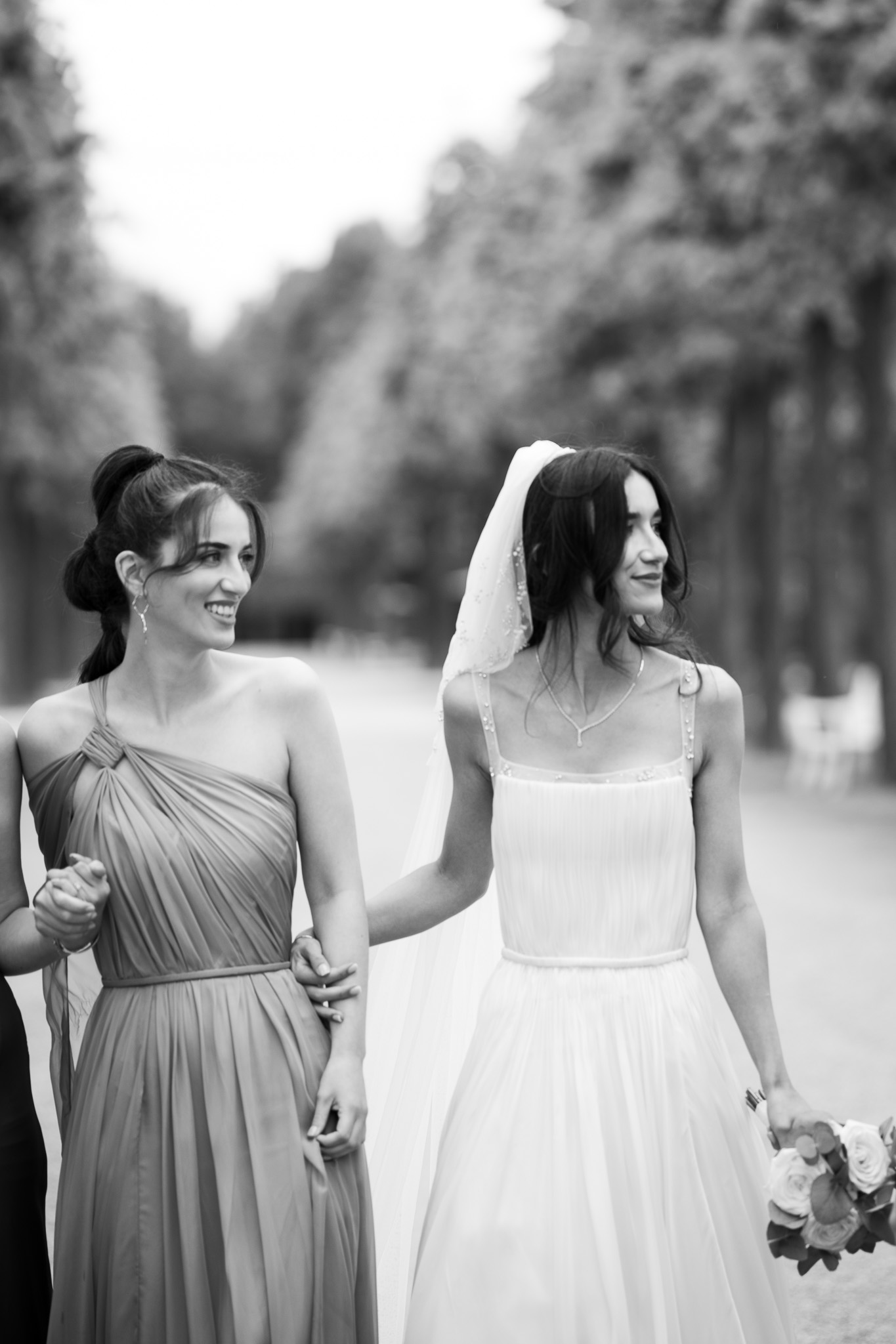 Eternal Moments: A Wedding Photography Collection by FADETOBLACK, wedding photography, image 16: Wedding series mixing black and white and color: a bride in a lace puff-sleeve dress beside a vintage car