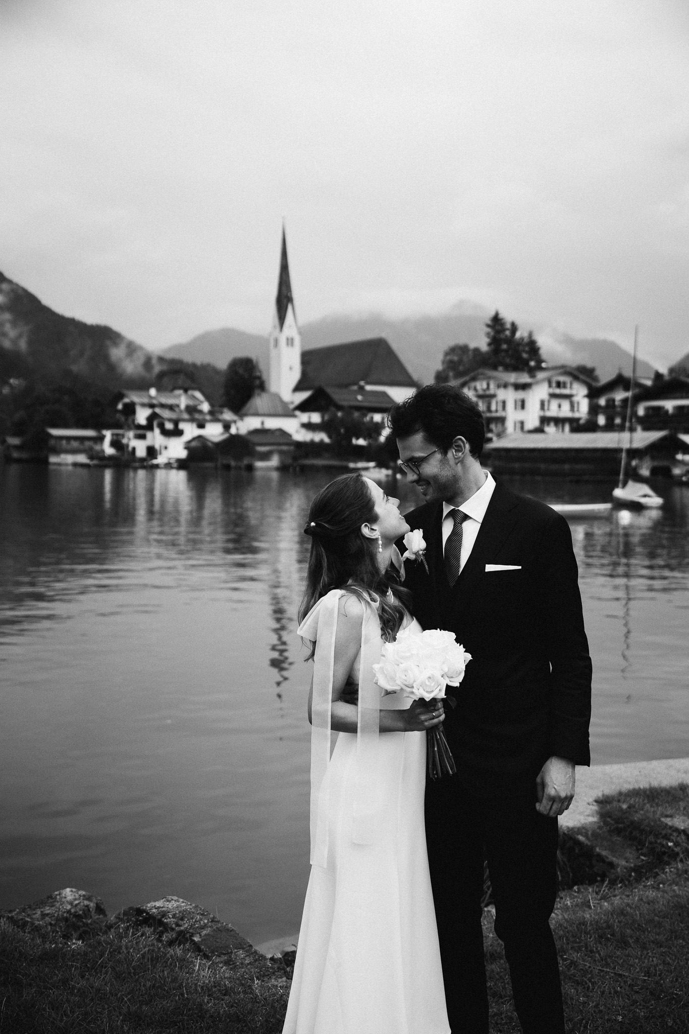 Eternal Moments: A Wedding Photography Collection by FADETOBLACK, wedding photography, image 21: Wedding series mixing black and white and color: a bride in a lace puff-sleeve dress beside a vintage car