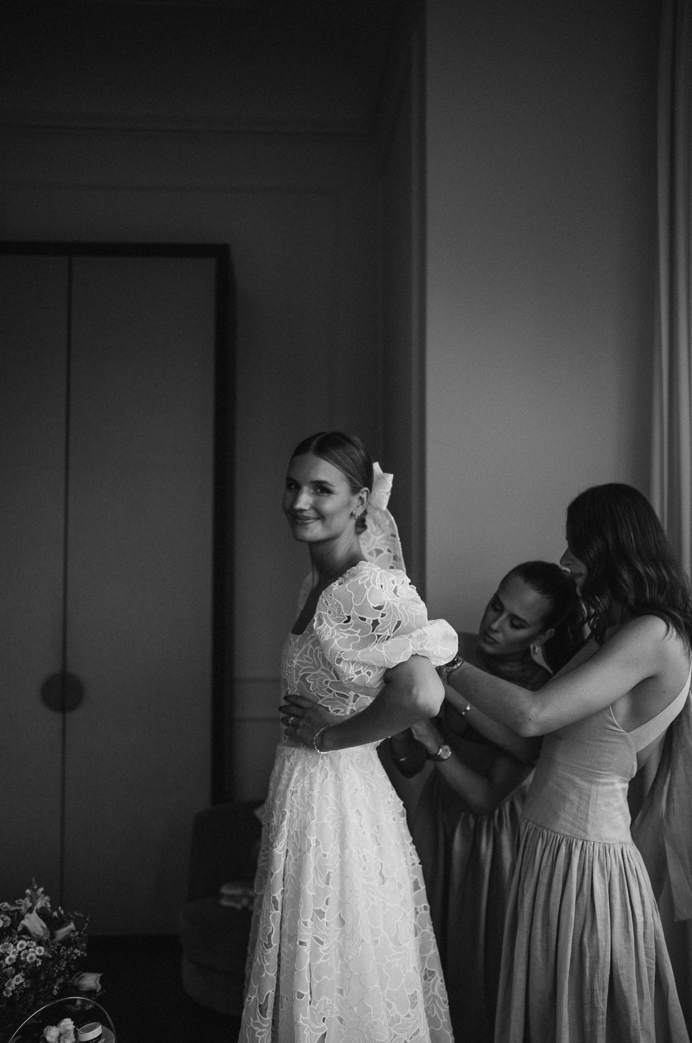 Eternal Moments: A Wedding Photography Collection by FADETOBLACK, wedding photography, image 8: Wedding series mixing black and white and color: a bride in a lace puff-sleeve dress beside a vintage car