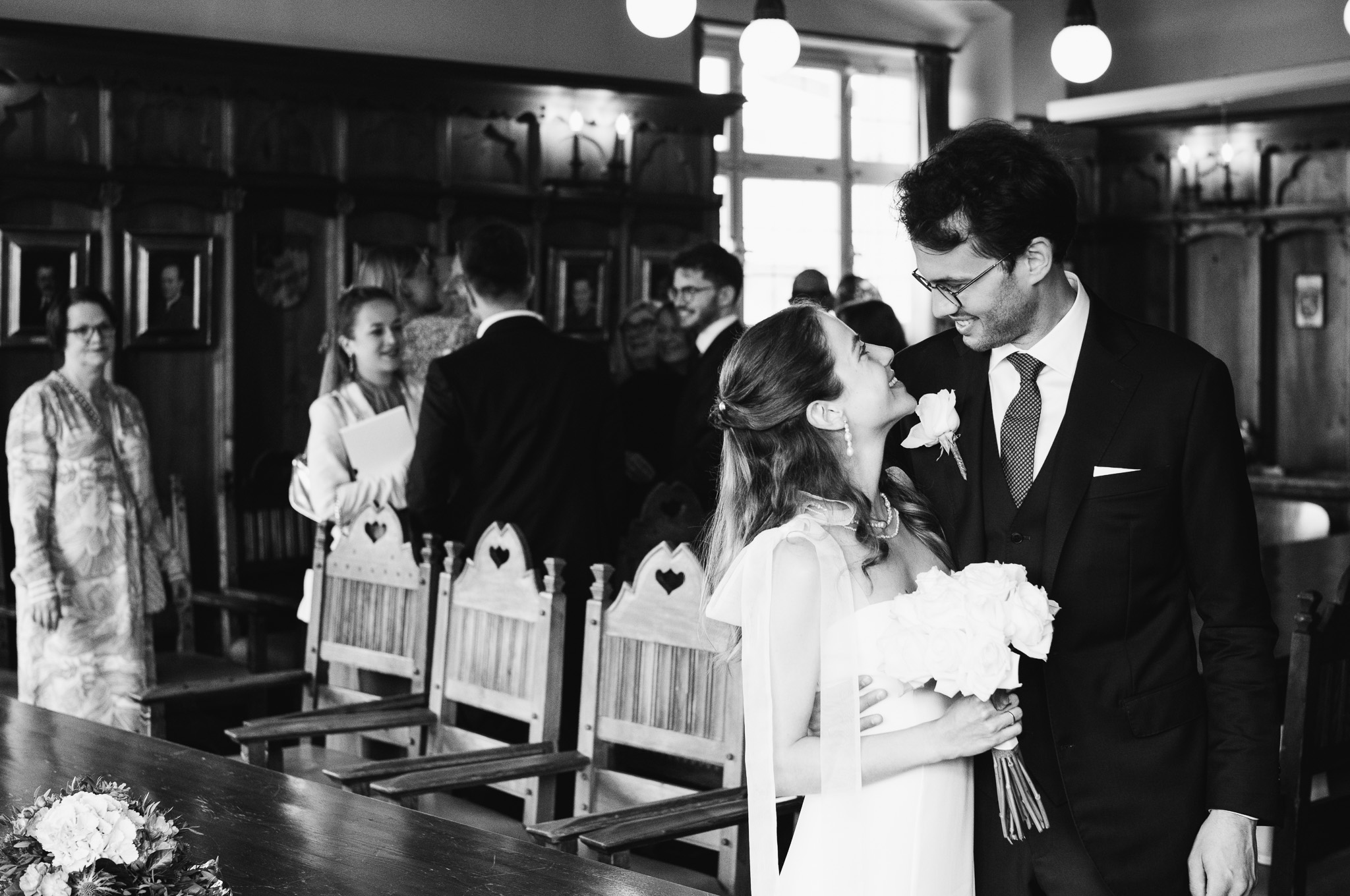 Eternal Moments: A Wedding Photography Collection by FADETOBLACK, wedding photography, image 37: Wedding series mixing black and white and color: a bride in a lace puff-sleeve dress beside a vintage car