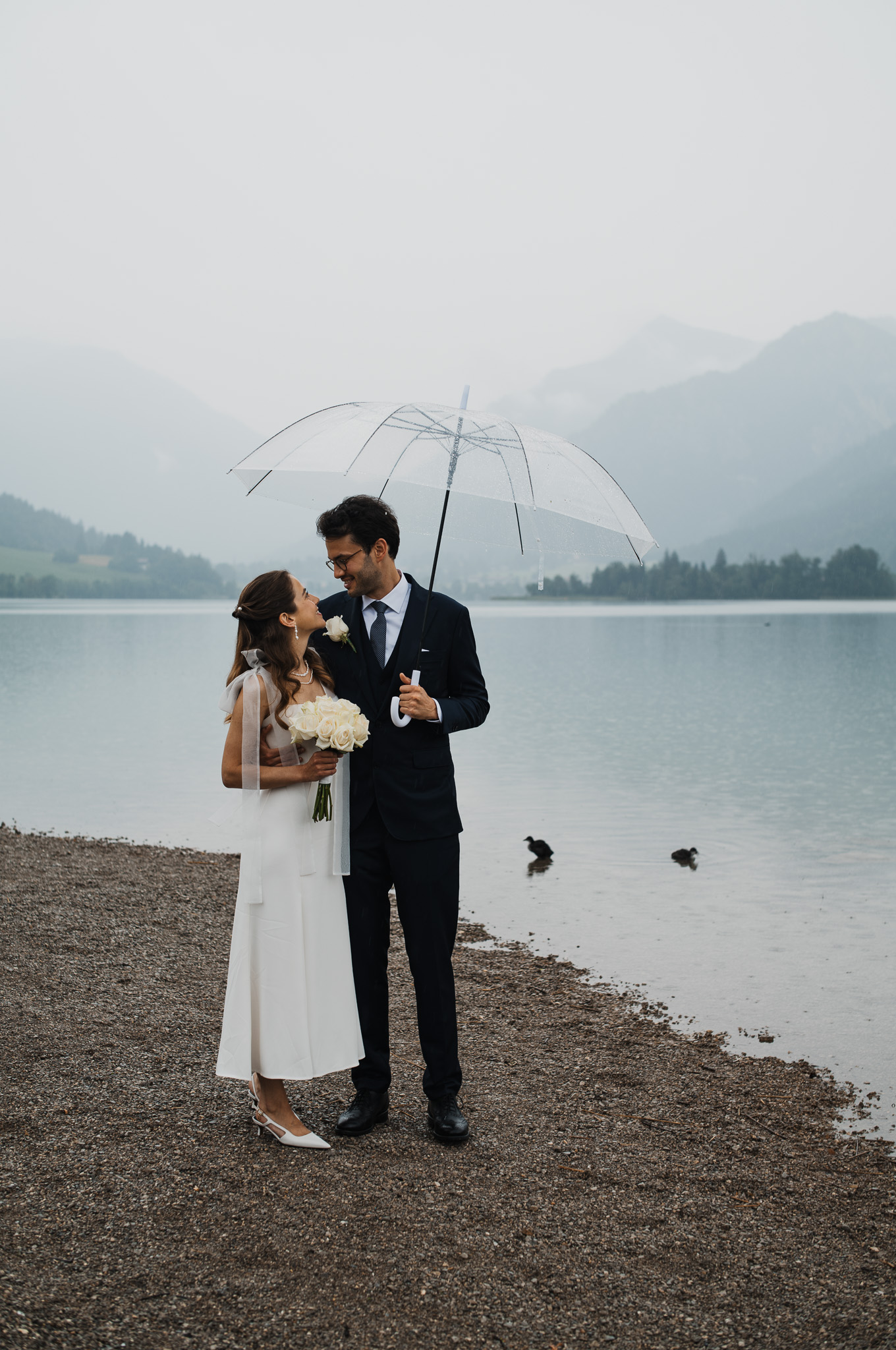 Eternal Moments: A Wedding Photography Collection by FADETOBLACK, wedding photography, image 23: Wedding series mixing black and white and color: a bride in a lace puff-sleeve dress beside a vintage car