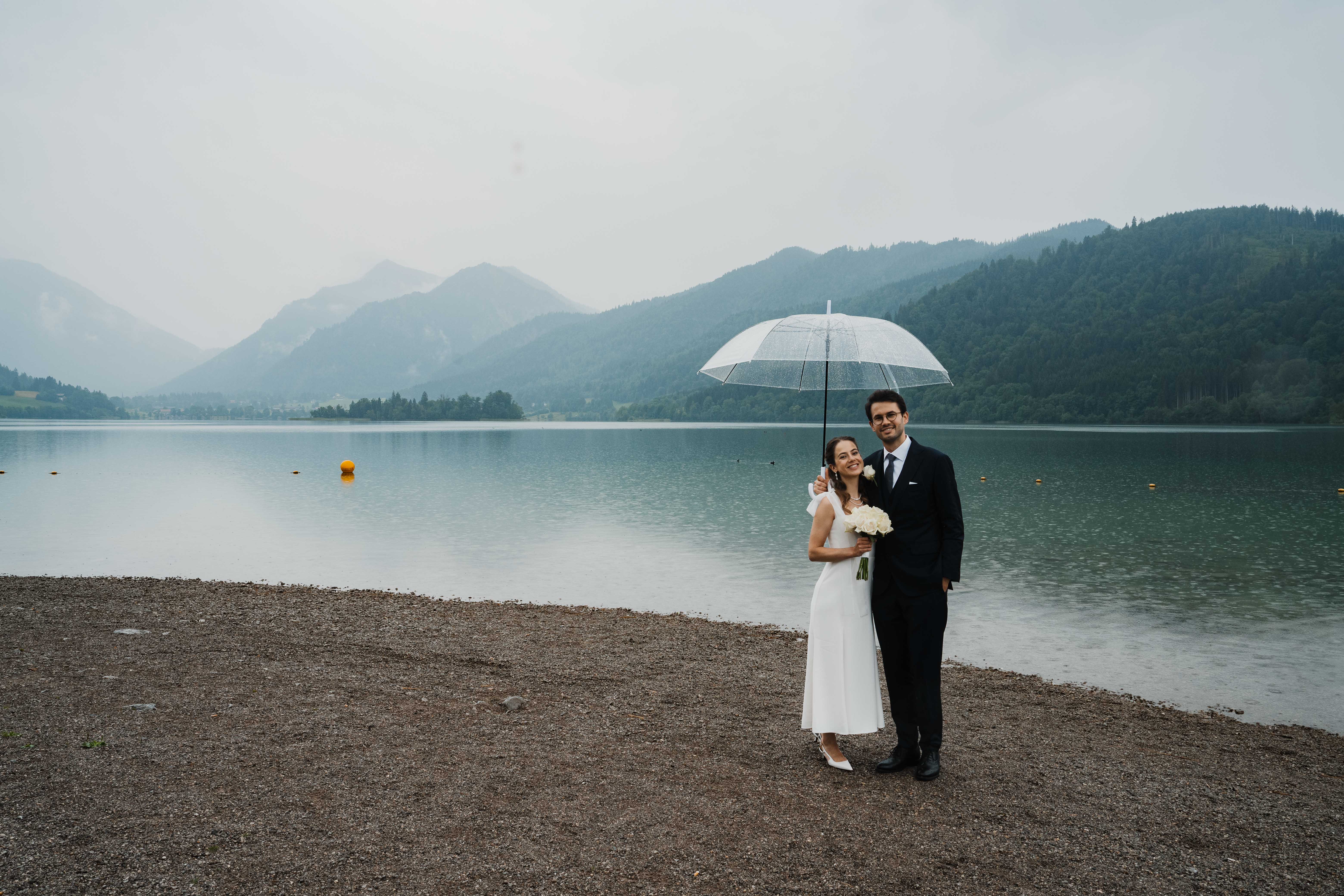 Eternal Moments: A Wedding Photography Collection by FADETOBLACK, wedding photography, image 36: Wedding series mixing black and white and color: a bride in a lace puff-sleeve dress beside a vintage car